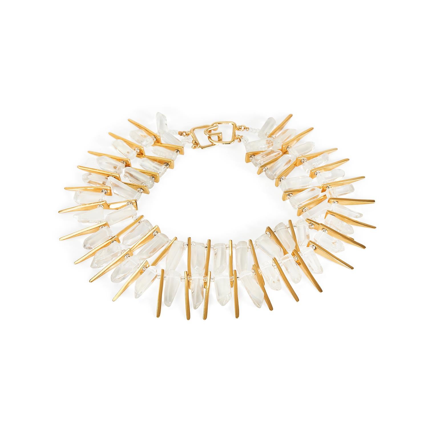 This incredible 1990s necklace by Kenneth Jay Lane makes a real statement and was designed to turn heads! It features a two strand chain comprised of elongated gold pieces, and clear glass beads which very realistically emulate rock crystal. The