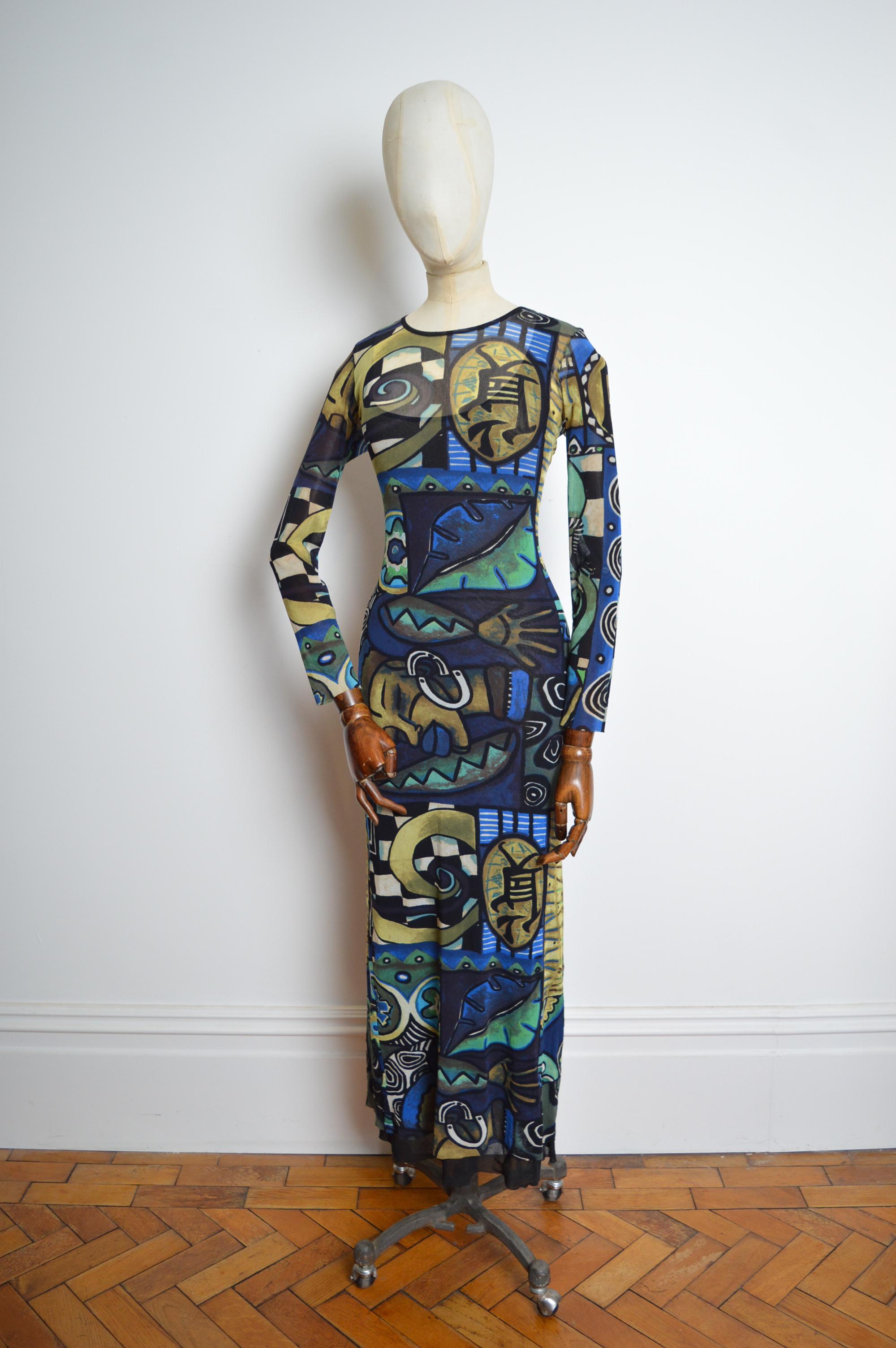 1990s KENZO Micro Mesh Blue abstract art print long sleeve maxi dress
Features: Super stretchy sheer micro mesh long sleeved dress complete with separate sheer black slip dress for those wanting a more modest look… or quite simply another dress in