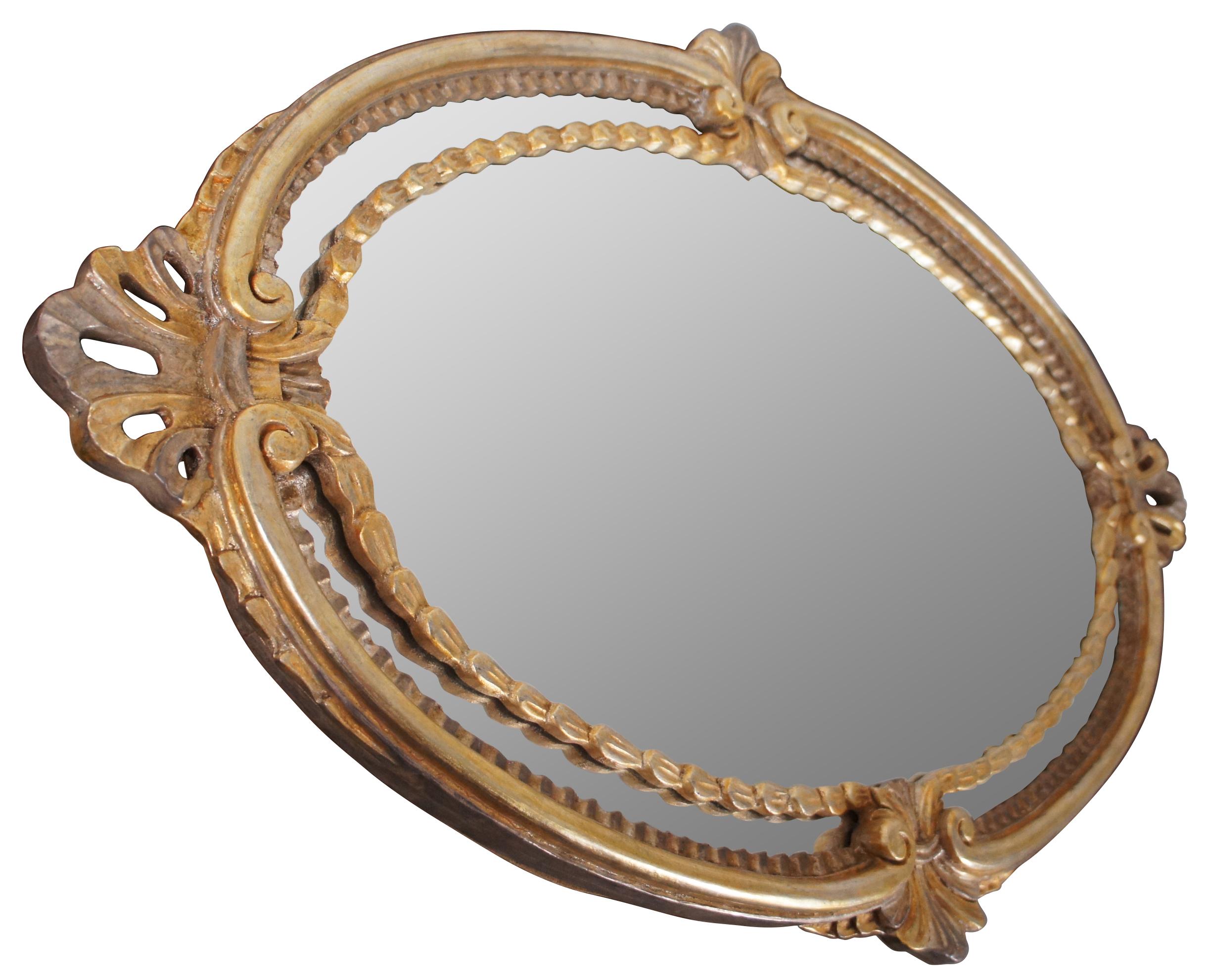 Vintage La Barge over mantel or vanity mirror. Made in Italy featuring Hollywood Regency style and ornate scalloped design.
 