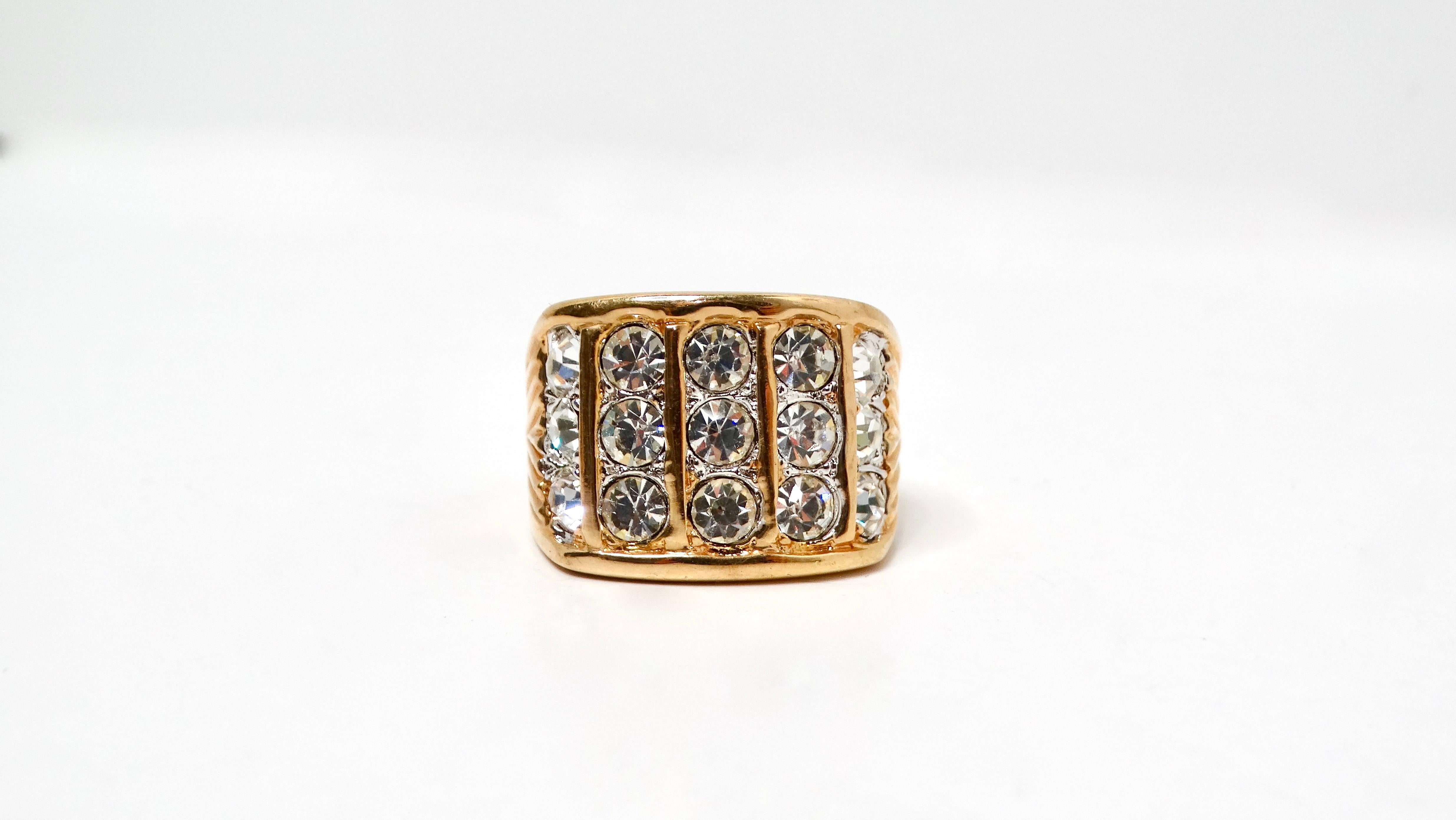Step back into the glamorous 1990s with this stunning Large 18k Gold Plated Linear Synthetic Crystal 5-Row Cocktail Ring. The ring features an eye-catching design, where five rows of shimmering synthetic crystals shine brilliantly, set against the