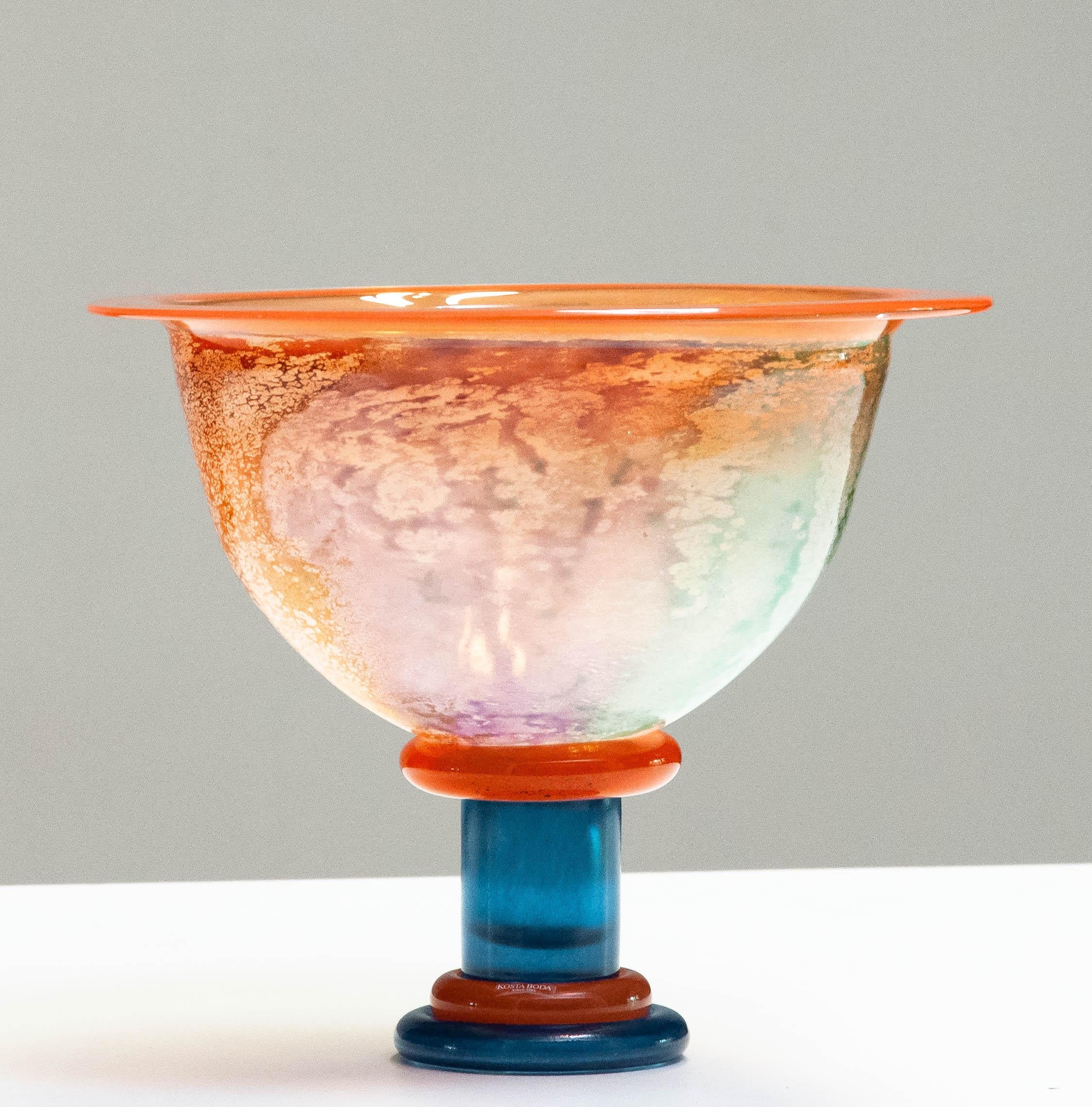 Beautiful large melange art glass in orange and blue bowl designed by Kjell Engman for Kosta Boda in the 1990's from the 'Cancan' series. Allover in very good condition.
The bowl is numbered and signed.