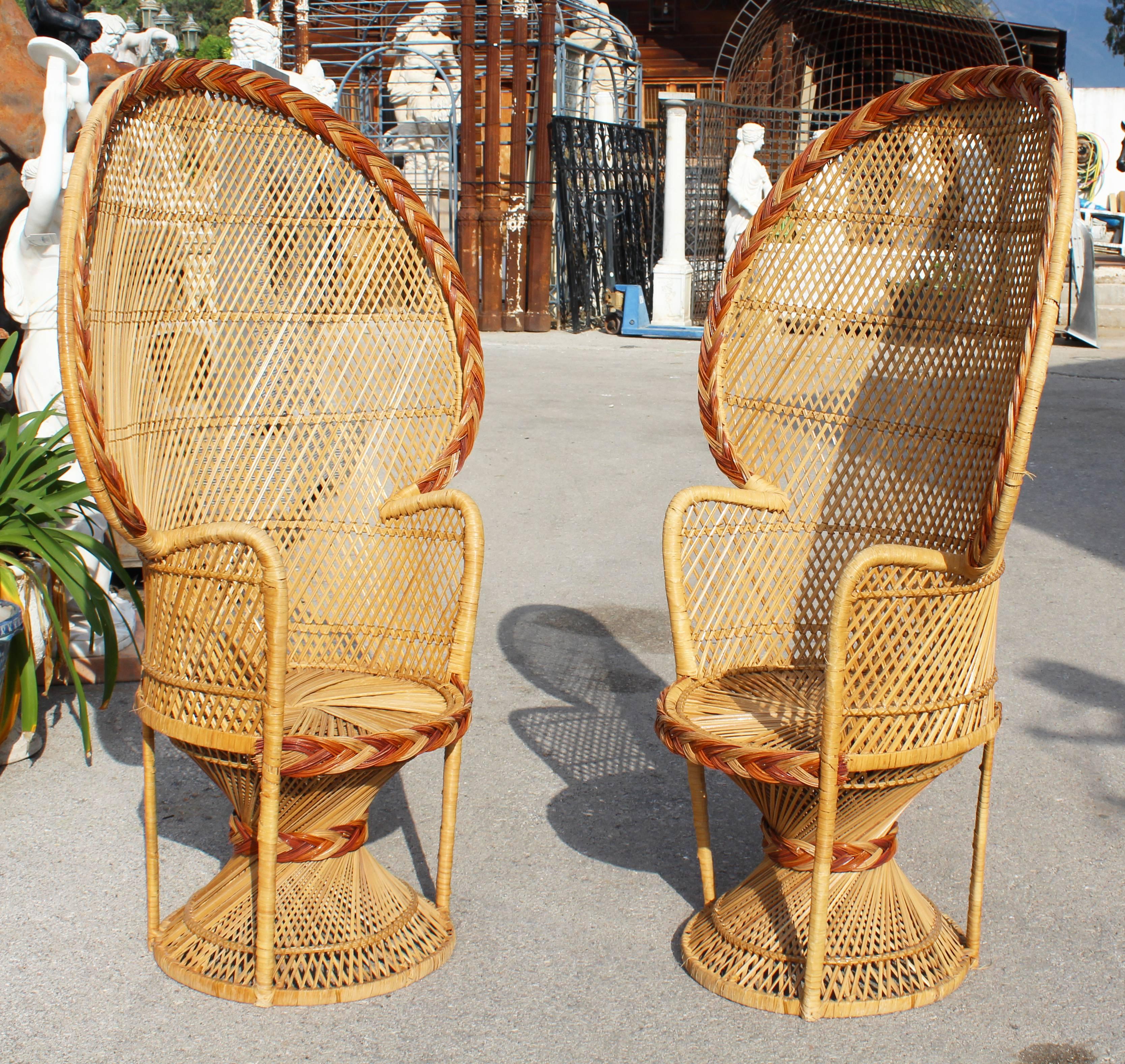 A large pair of vintage Bohemian high quality wicker peacock chairs, made famous in 1974 by actress Sylvia Kristel in the movie 'Emmanuelle' where she sat half naked.
