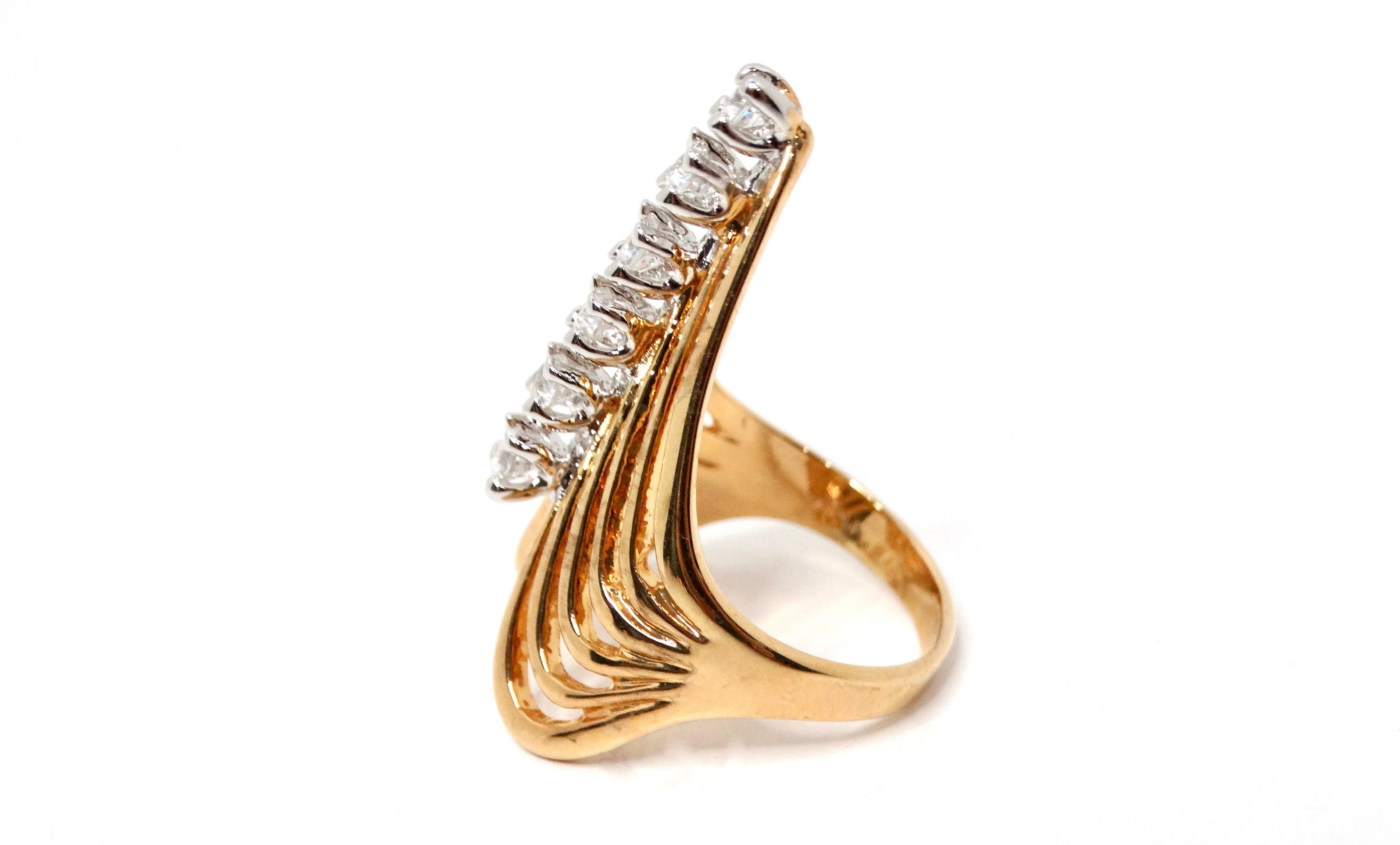 The 1990s Layered 18k Gold Plated V-Shape Crystal Fashion Ring is a stunning representation of vintage elegance. This beautifully crafted piece features intricate layered V-shape that adds depth and dimension, while the sparkling synthetic crystals