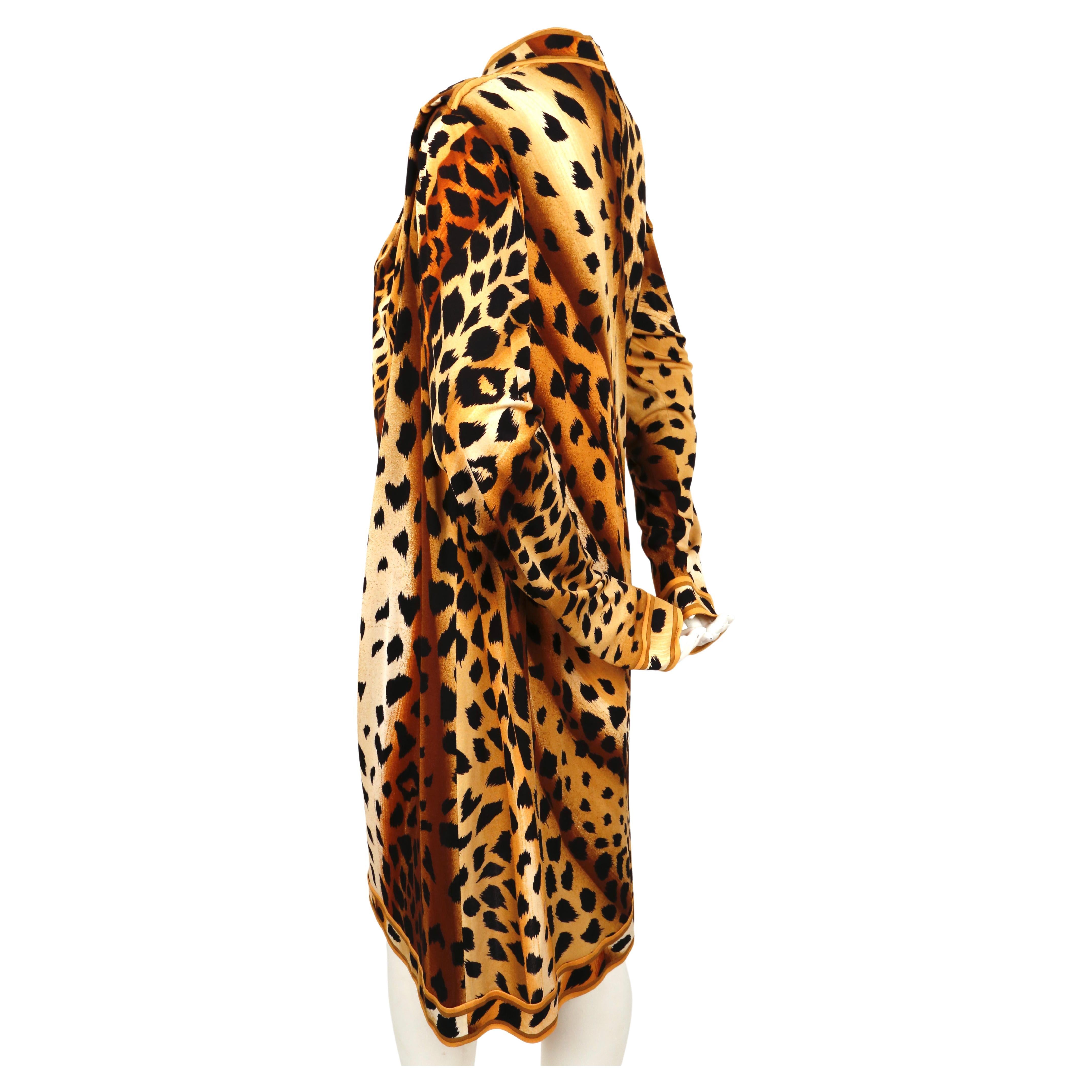 Vivid, leopard-printed, silk-jersey dress with draped cut designed by Leonard dating to the 1990's. No size is indicated however this would best fit a US 8-10. Approximate measurements: shoulder 19