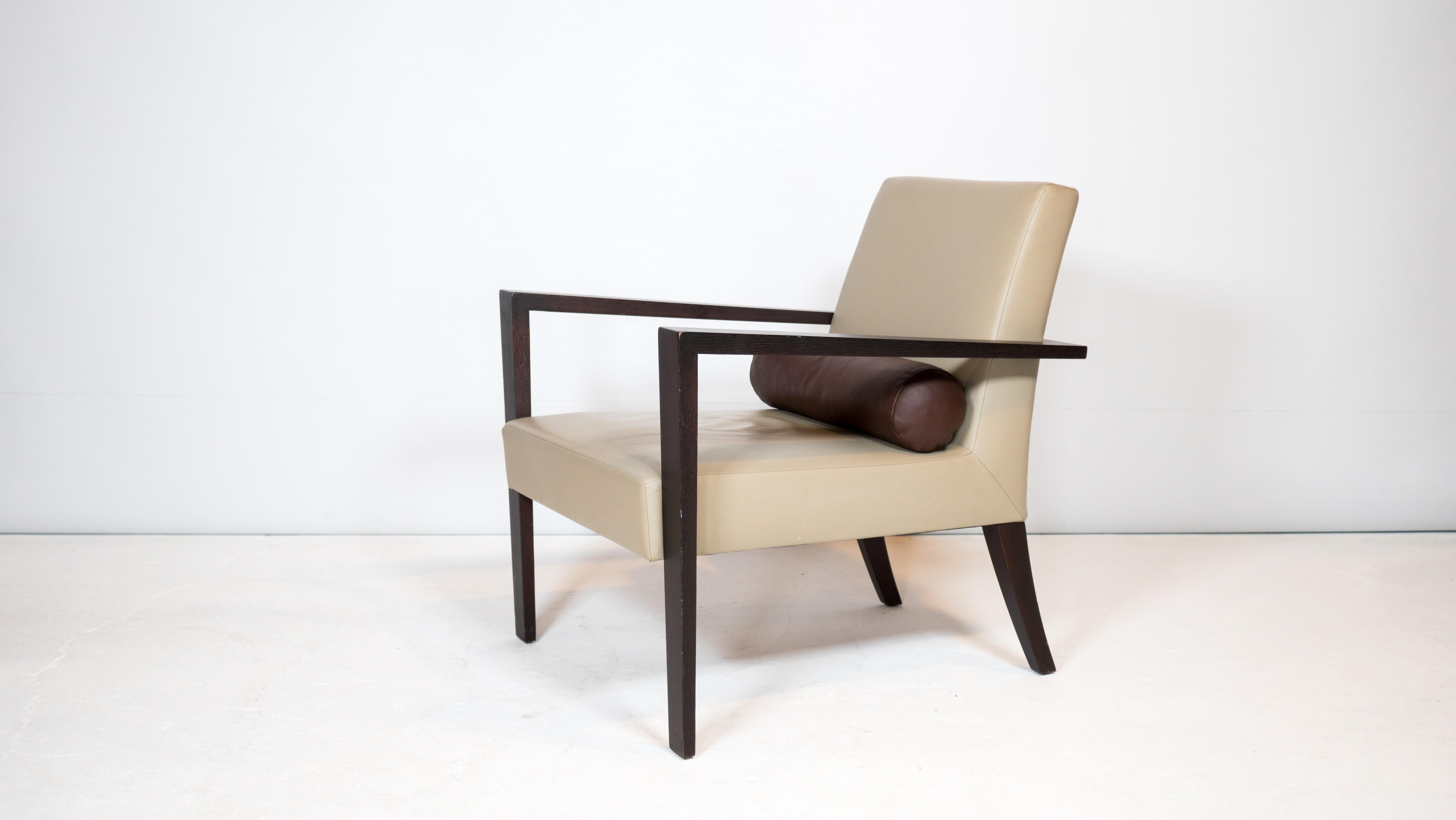 Ligne Roset 'French Line' chair by Didier Gomez, circa 1990s. Modern design with angular silhouette. Solid wood frame and buttery beige leather seat. Down filled polochon. Good condition. Manufacturer label present. Made in France.