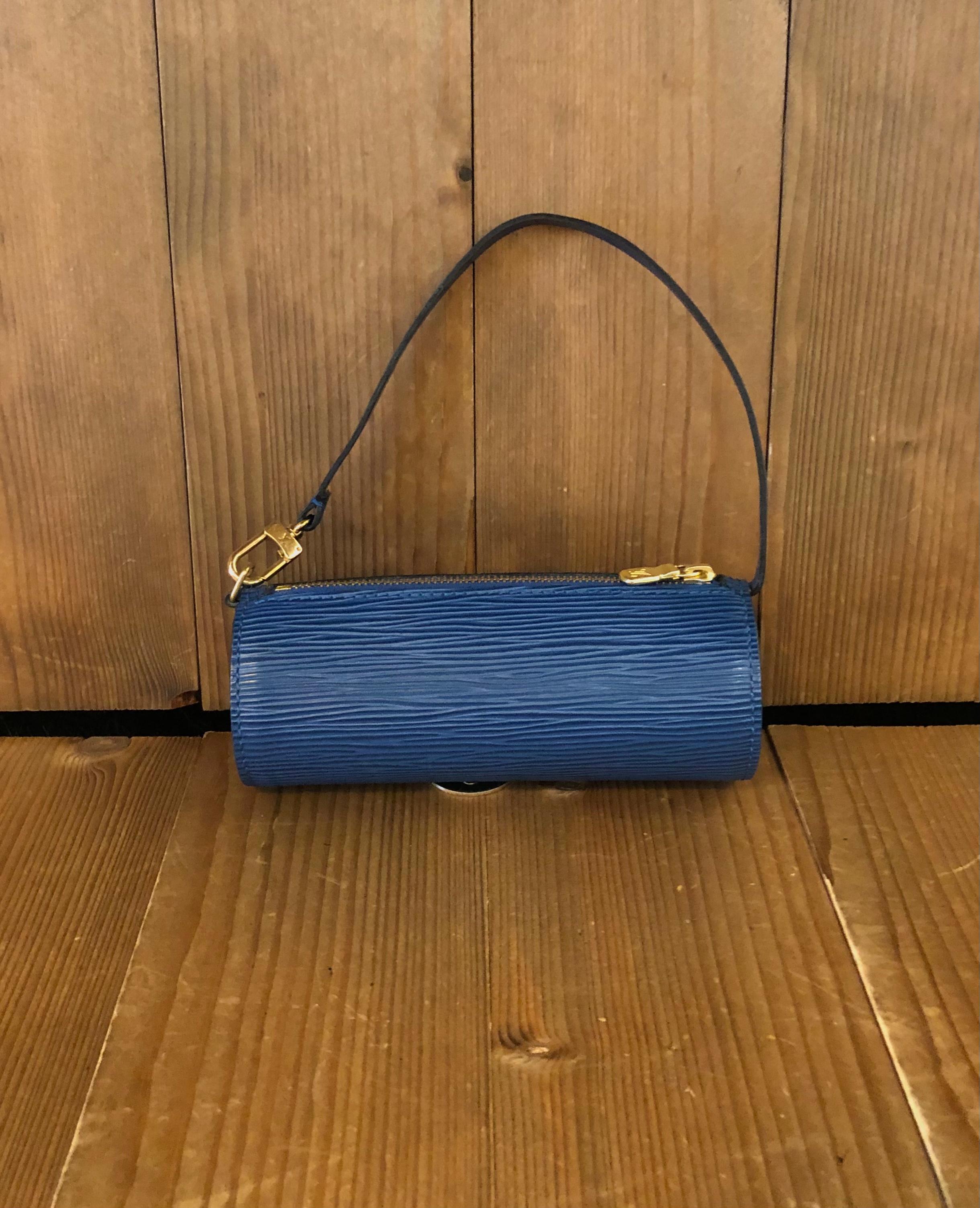 1990s LOUIS VUITTON mini Papillon pouch in blue Epi leather. It originally came with the mother Papillon bag. Made in France. Measures 6.25”x 2.25”x 2.25”. Comes with complimentary non-LV chain.

Condition - Minor signs of wear. Generally in very