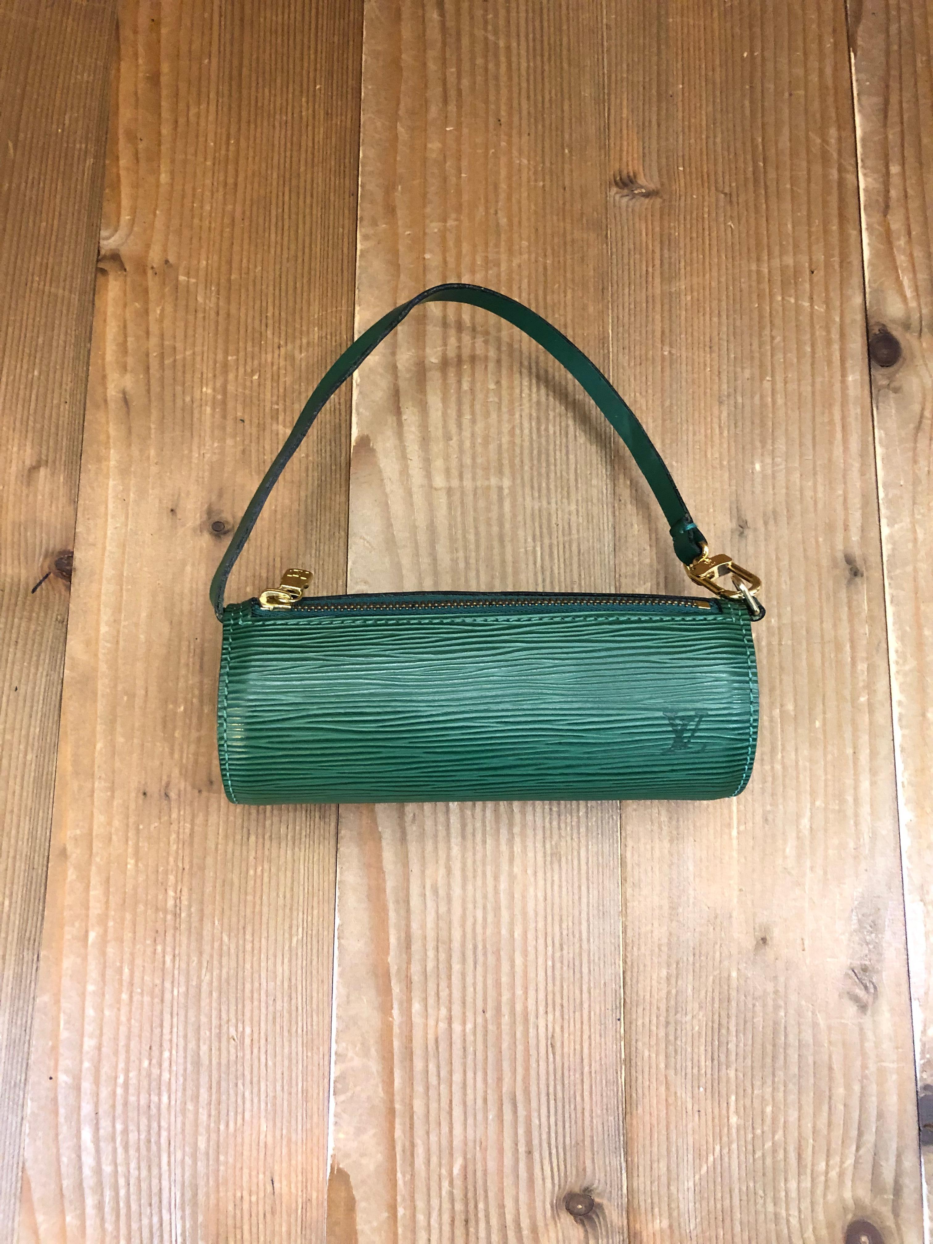 1990s LOUIS VUITTON mini Papillon pouch in green Epi leather. It originally came with the mother papillon. Rhianna was photographed carrying one. Made in France. Measures 6.25”x 2.25”x 2.25”. Comes with complimentary non-LV chain.

Condition - Minor