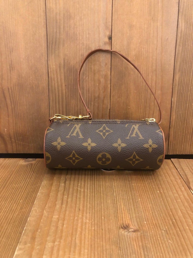 1990s LOUIS VUITTON mini Papillon pouch in brown monogram canvas and leather. Made in France. Measures 6.25”x 2.25”x 2.25”. Comes with dust bag and complimentary non-LV chain.

Condition - Minor signs of wear. Generally in very good condition.