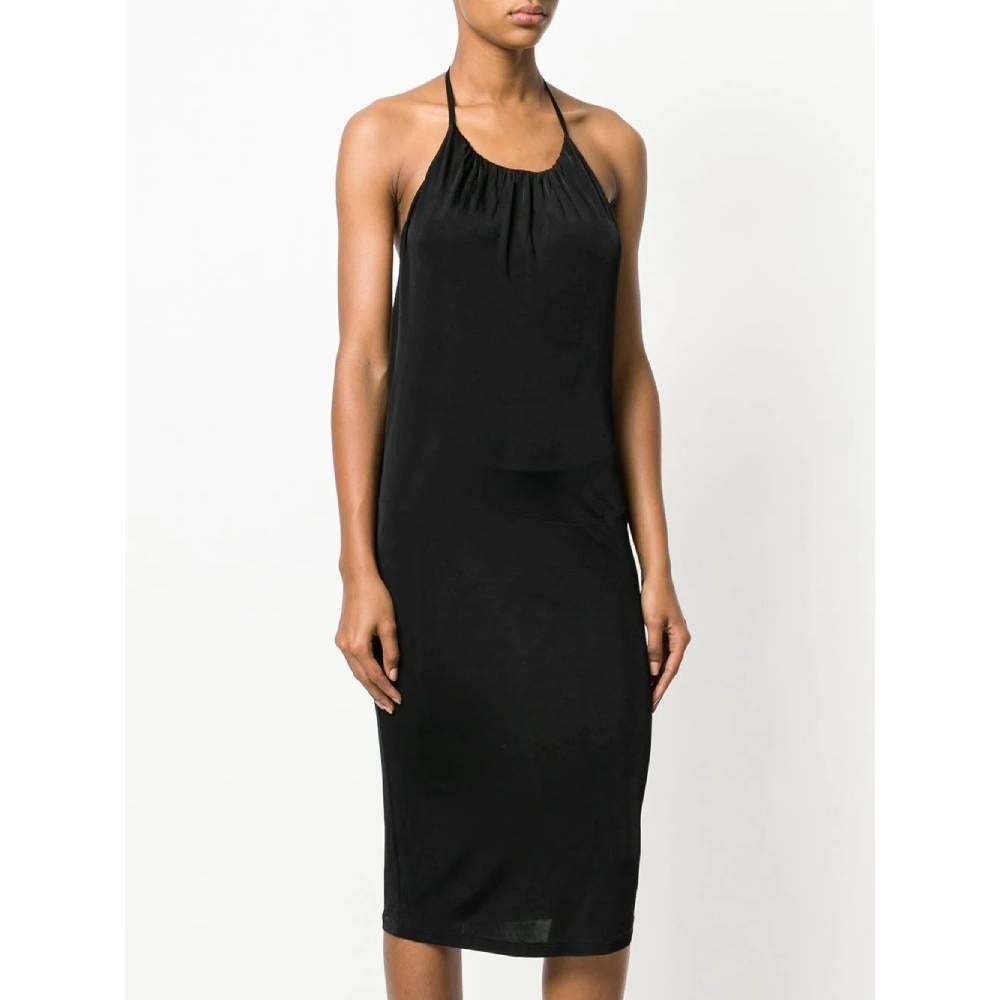 Love Moschino black midi dress. Halter neck model laced on the neck and without sleeves.

Years: 90s 

Made in Italy 

Size: 42 IT 

Flat measurements 

Height: 102 cm 
Bust: 42,5 cm 