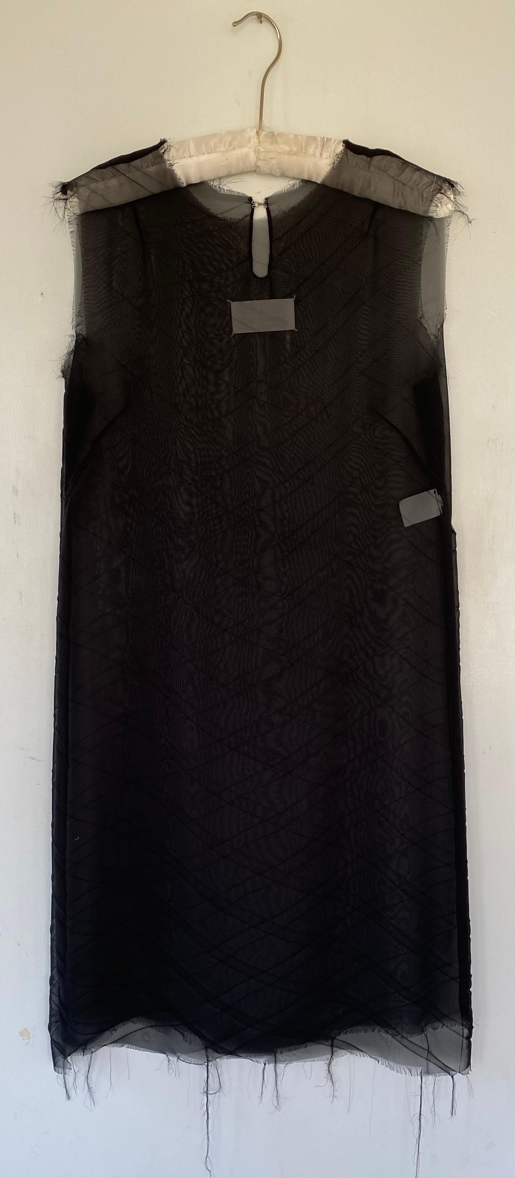 Maison Martin Margiela dress from the 1990s , I believe this dates to 1997  
Collar , hem and sleeves are raw 
Closes at the back with hook and eye 
Ghost label 
Size 42 
Excellent condition 
100% poly