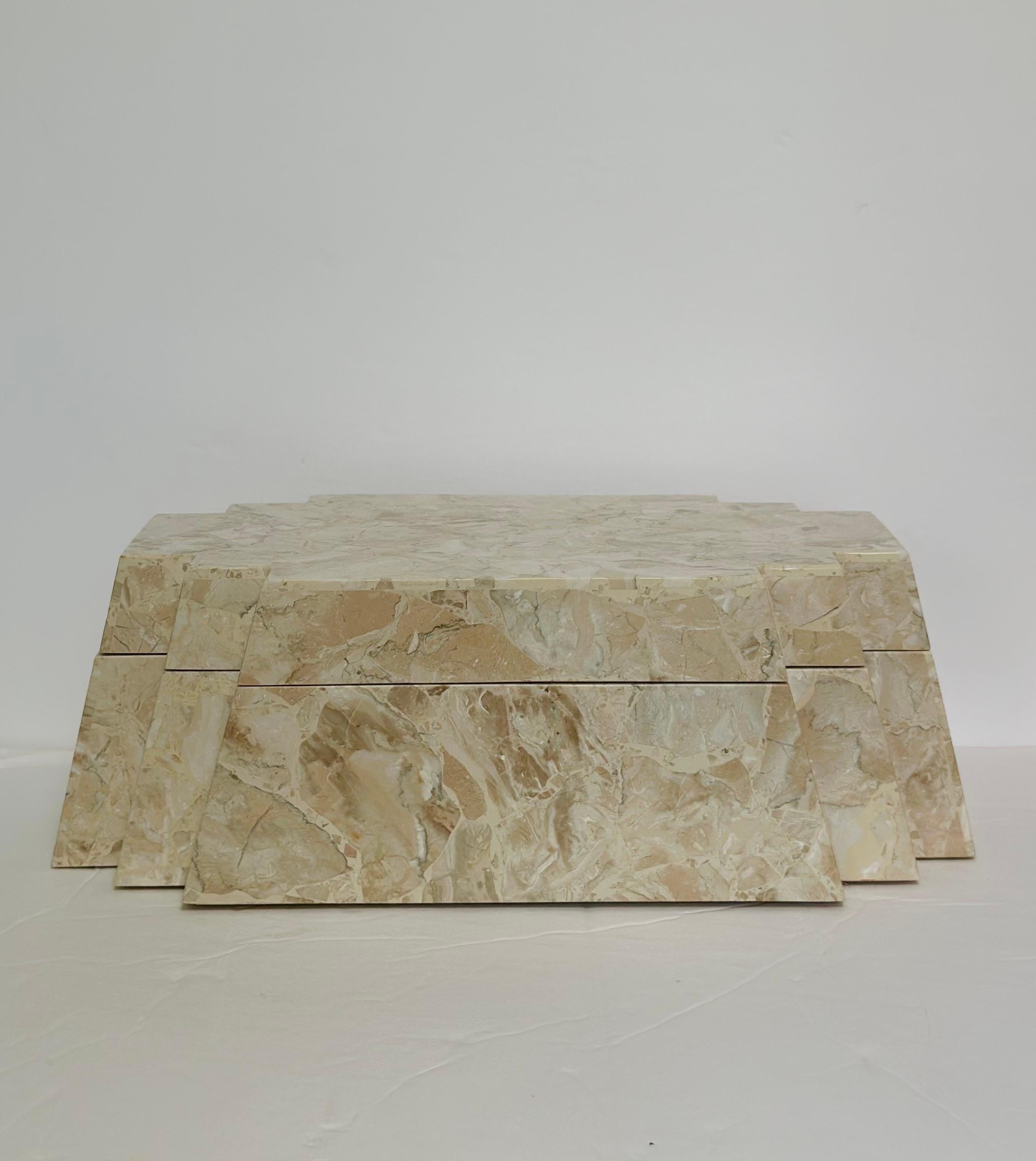 We are very pleased to offer a vintage Maitland-Smith decorative box, showcasing the brand’s renowned craftsmanship and sculptural presence.  This piece is clad in tessellated stone, with natural veining in warm beige and cream tones that create a