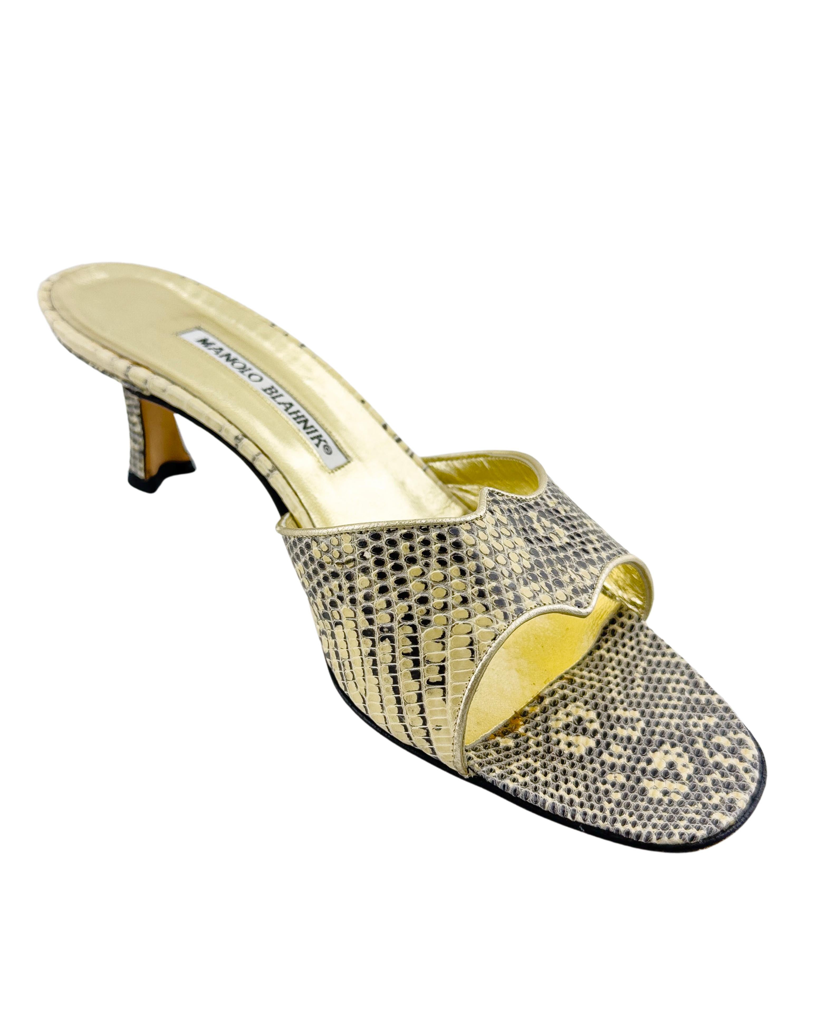 The SITC style shoe, this Manolo from the mid 1990s is a classic style with a twist; exotic skin and gold leather. In good condition, some wear to the soles. Marked a FR 38.5, fits a US 8.5.
