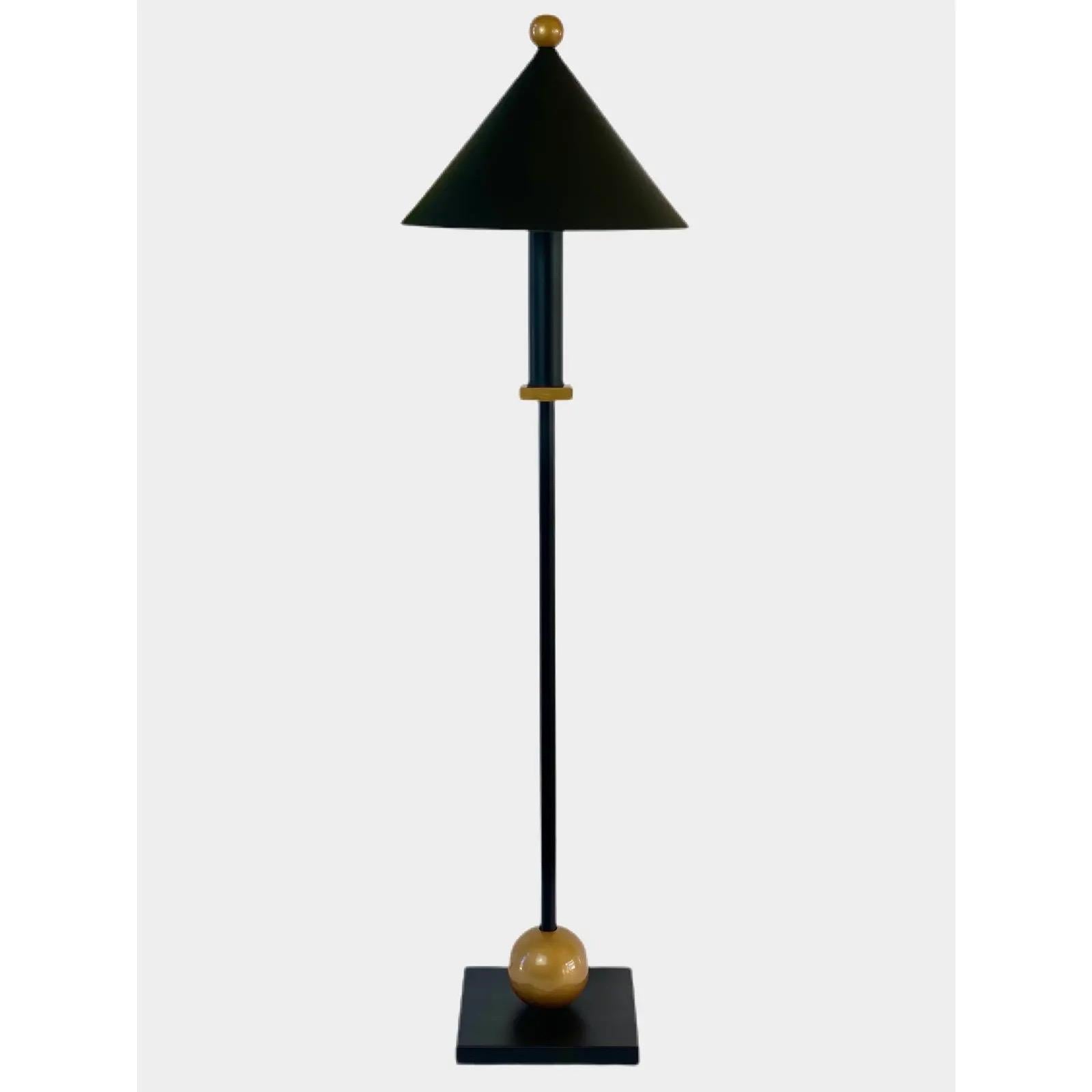 We are very pleased to offer a sculptural, Memphis style table lamp by the recognizable designer Robert Sonneman for George Kovacs, circa the 1990s. Made of a black satin powder coated metal body and warm gold details. With its clean lines and