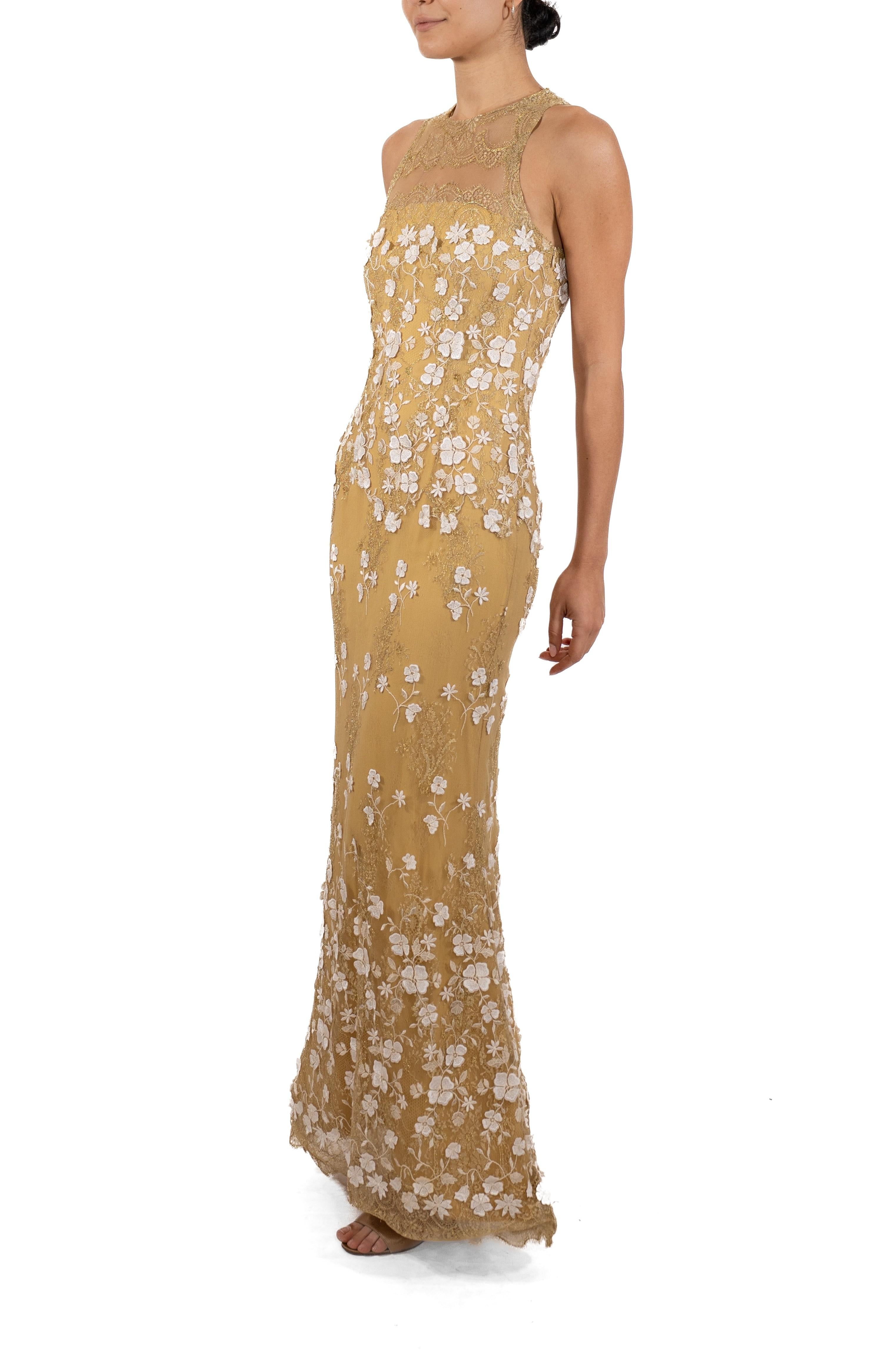 This gown retains no label, however the amount of hand-finishing points to Haute Couture or custom made quality, fully lined in silk. 1990S Metallic White & Gold Silk Blend Lace Gown With Appliqué Flowers 