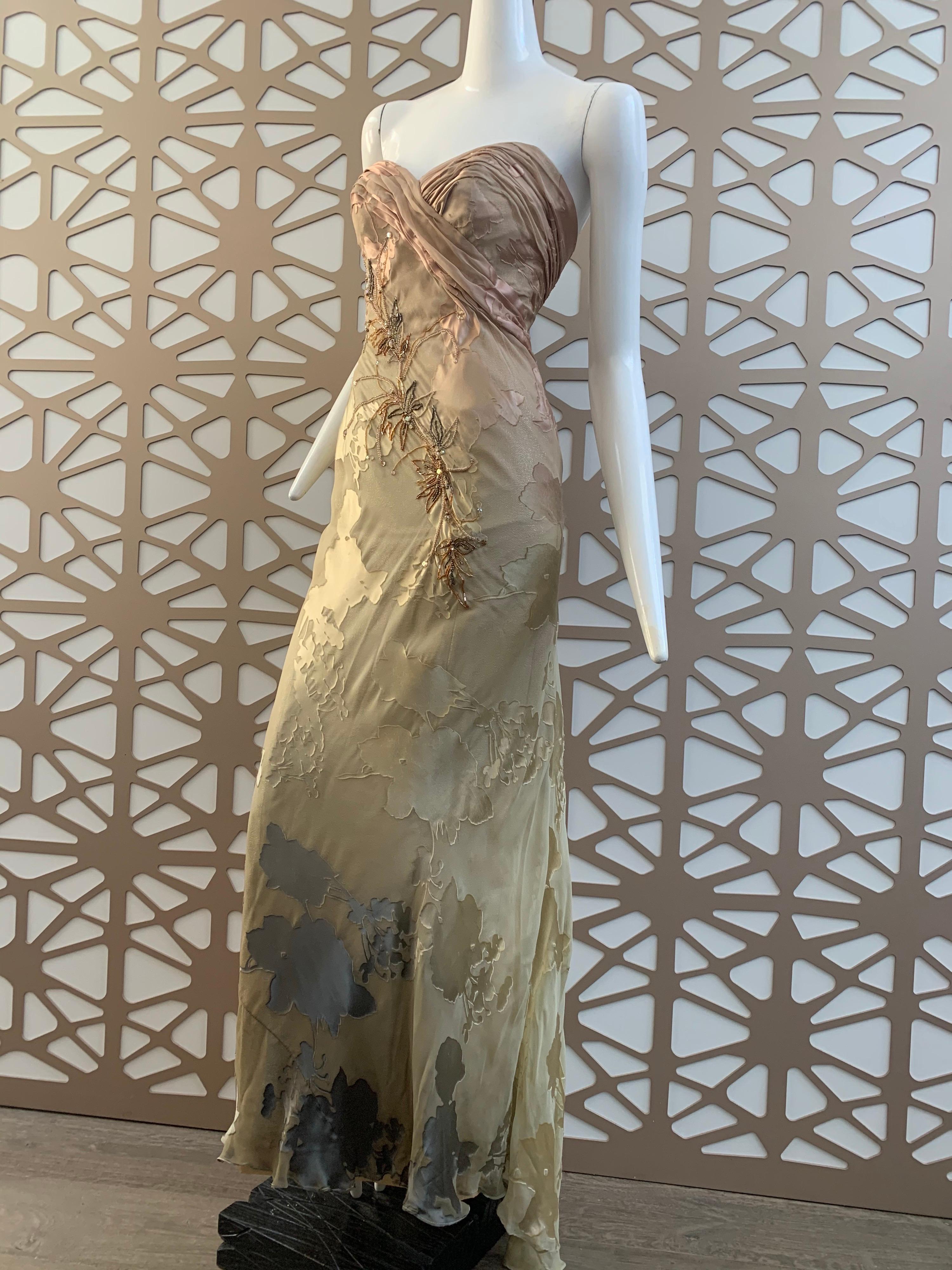 A lovely 1990s Michael Casey silk ombre botanical-patterned silk chiffon strapless gown with ruching and gathering at bodice.  Asymmetrical delicate bronze toned bamboo leaf beaded garland at front. Boned and lined in gold silk lame. Train wraps