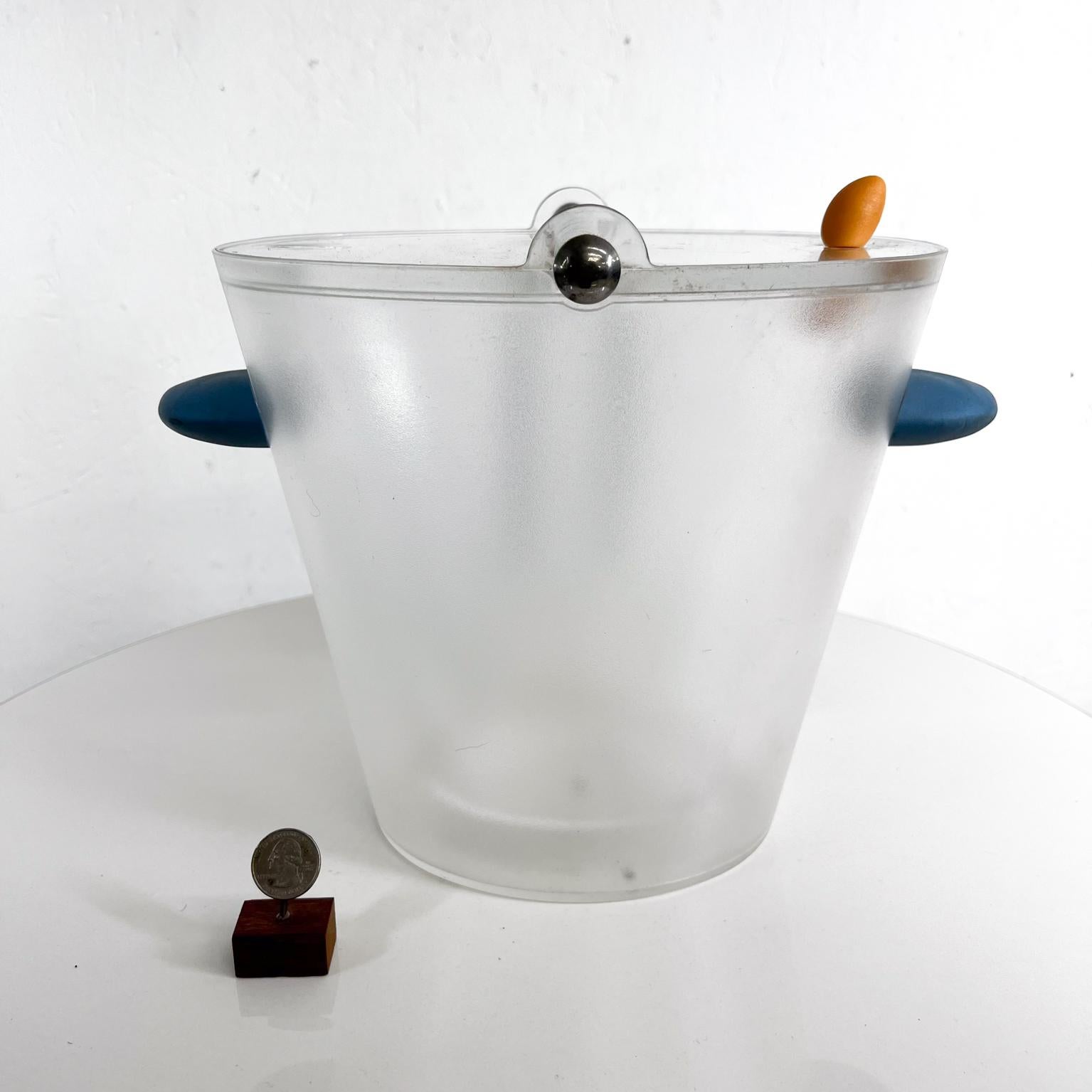 1990s Michael Graves Ice Bucket with Tongs
Frosted plastic and metal
11.38 w x 9 d x 10.5 h
Preowned original vintage condition.
Refer to provided images.