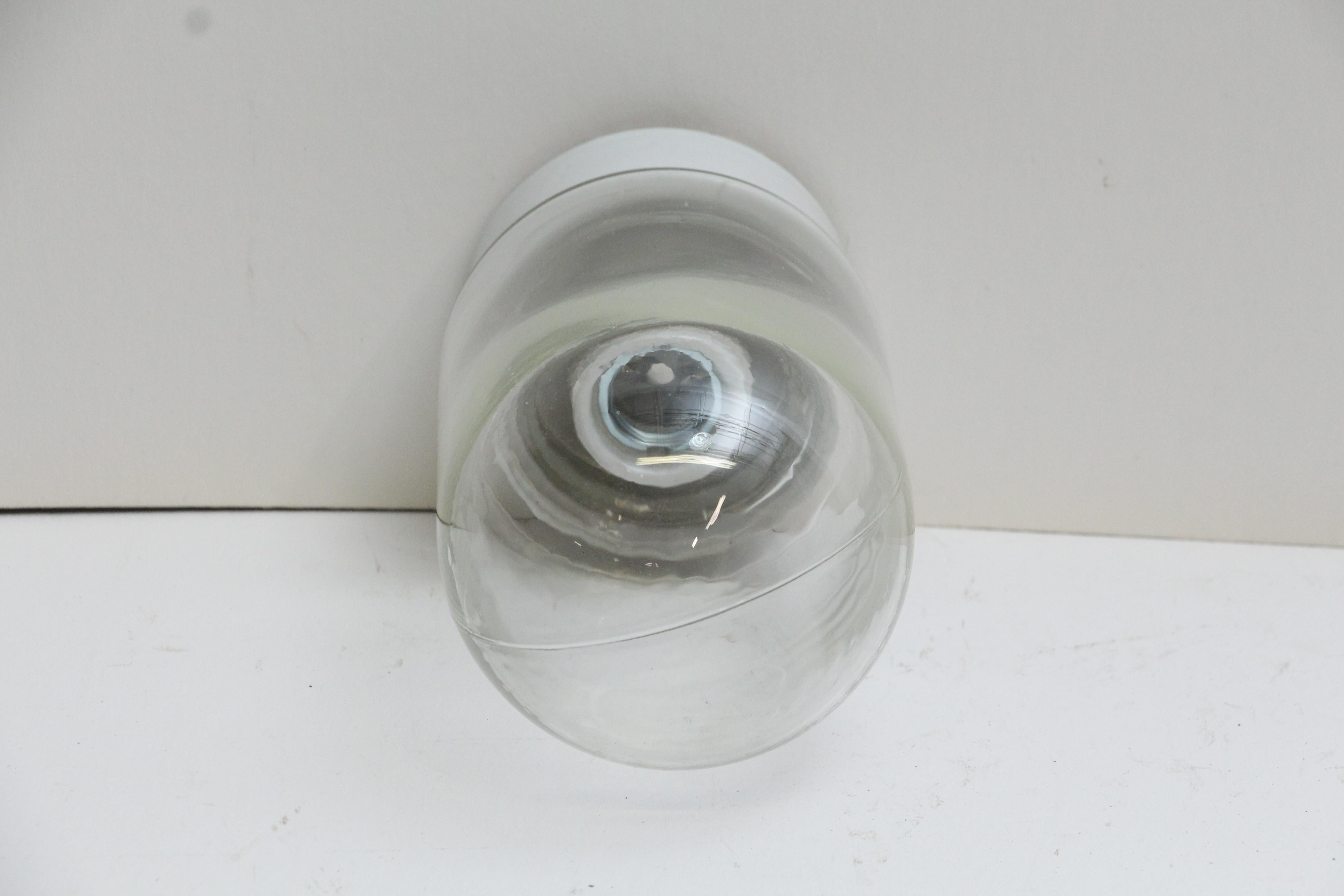 Mid-Century Modern styling single socket porcelain base fixture with clear jar shaped glass. Cleaned and rewired. Small quantity available at time of posting. Please inquire. Priced each. Please note, this item is located in one of our NYC locations.