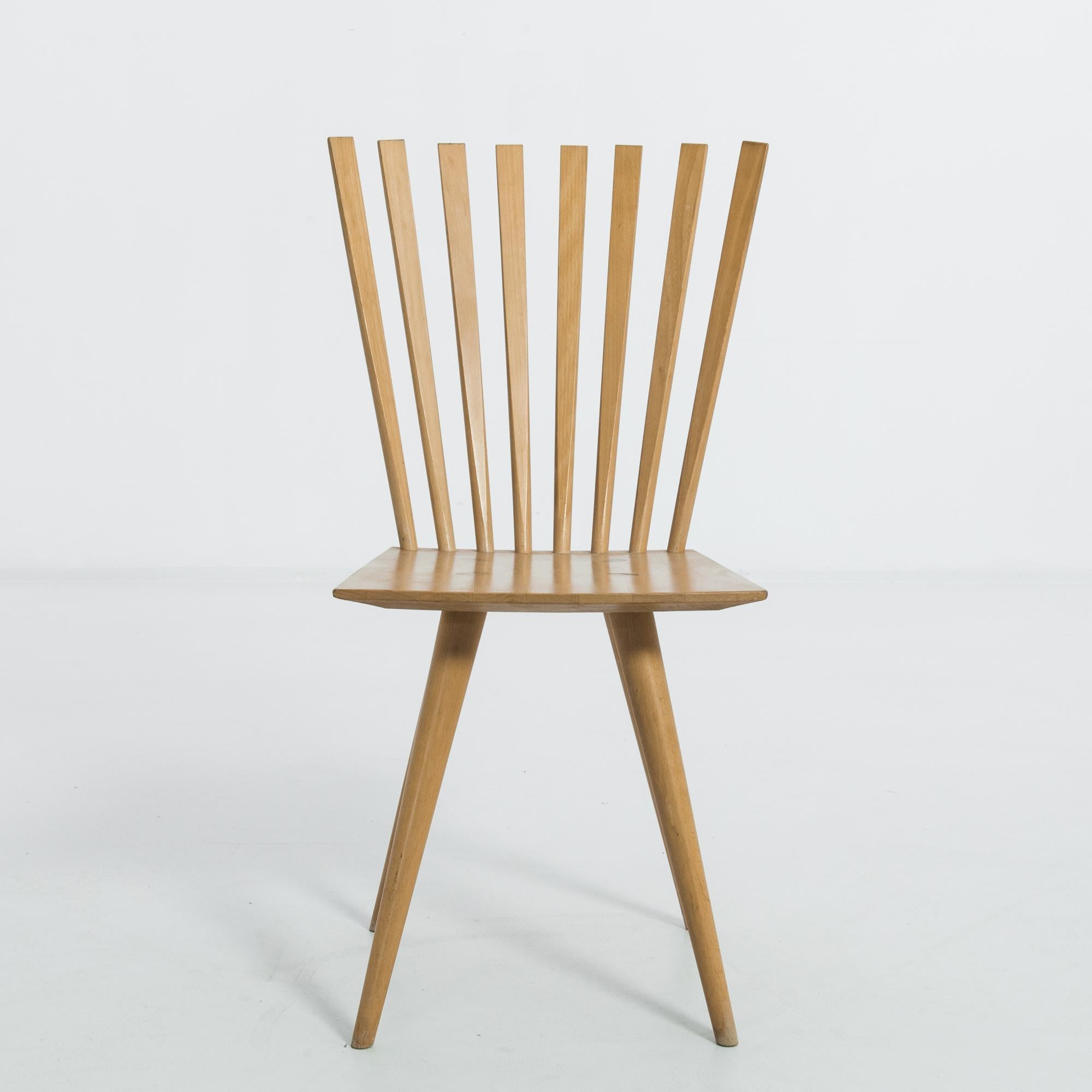 This pair of wooden chairs was made in Denmark, circa 1990. Designed by Johannes Foersom and Peter Hiort-Lorenzen, these ‘Mikado’ chairs were inspired by the English Windsor chair, which was constructed based on the idea of the seat joining all the