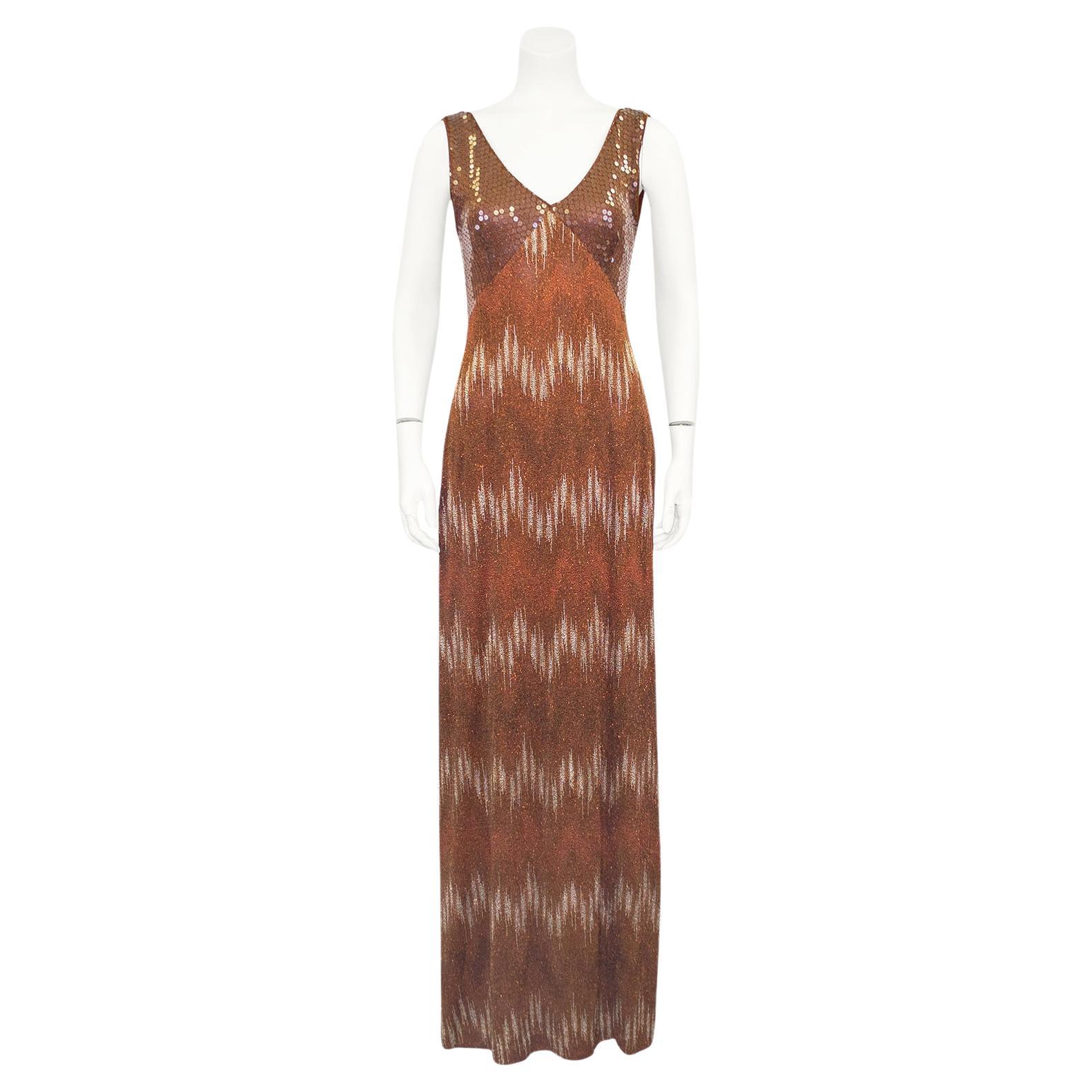 Stunning Missoni bronze knit gown and shawl ensemble from the 1990s. The gown is sleeveless with a v neckline. The bust is fully embellished with iridescent sequins that look brown with the fabric underneath showing through. These sequins reflect