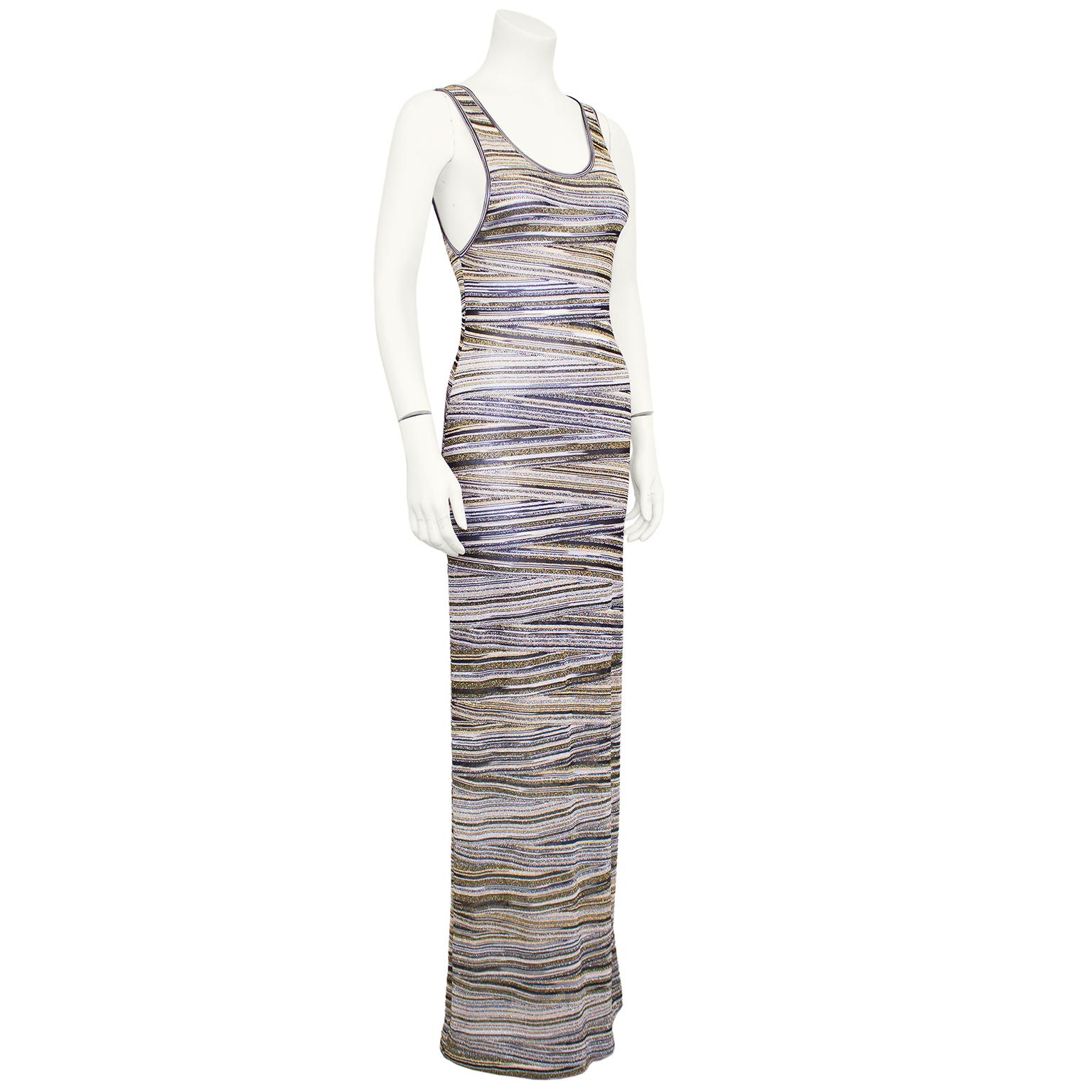 Lovely Missoni grey, silver, black and gold metallic lurex abstract horizontal stripe knit maxi dress from the 1990s. Sleeveless with a round neckline. Unlined - can be worn sheer or with a slip underneath. Can be daytime chic with flats, or dressed