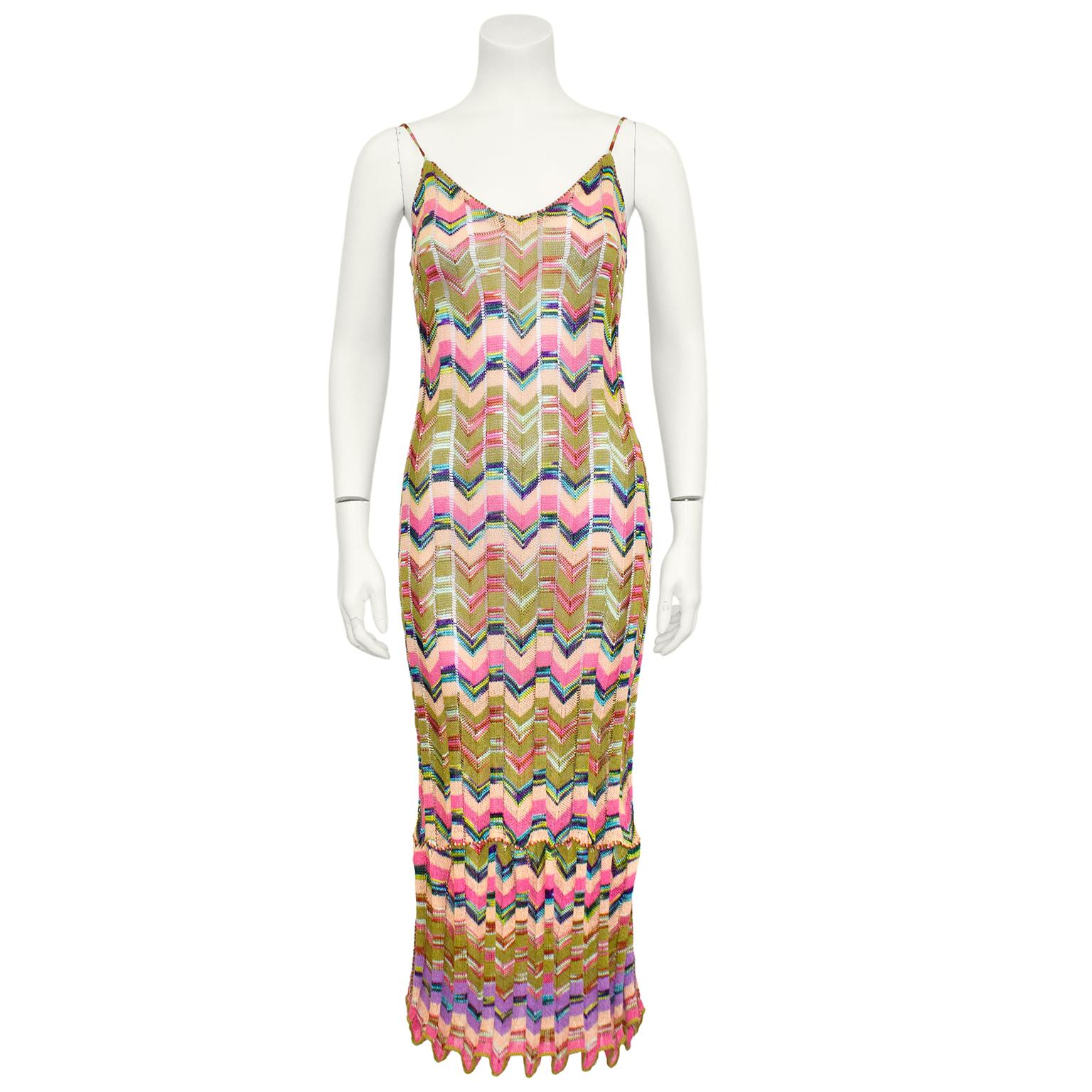 Beautiful Missoni ensemble from the 1990s. The classic and iconic Missoni knit chevron in olive green, pink, peach, green, blue and purple. Midi dress is spaghetti strap with a deep scoop neckline. Ensemble is completed with matching long sleeve mid