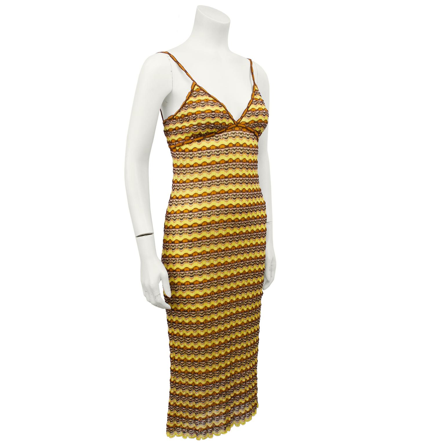 1990's Missoni yellow and brown knit eyelet dress. The iconic and instantly recognizable Missoni knit chevron/scallop. Spaghetti straps with tan and brown metallic trim that mimics a weaved draw string. V neckline. Body con and slightly sheer.