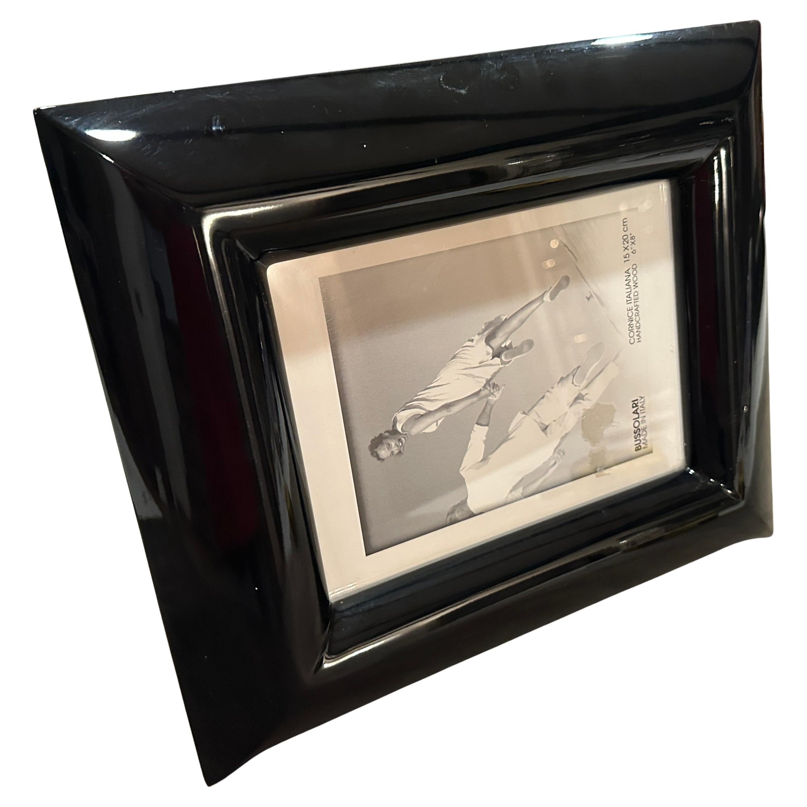 Vintage 1990s Bussolari Italian Picture Frame
This is a beautiful and authentic vintage picture frame from the 1990s, designed and crafted by the Italian brand Bussolari. Made in Italy, this piece is a wonderful example of the era's minimalist and