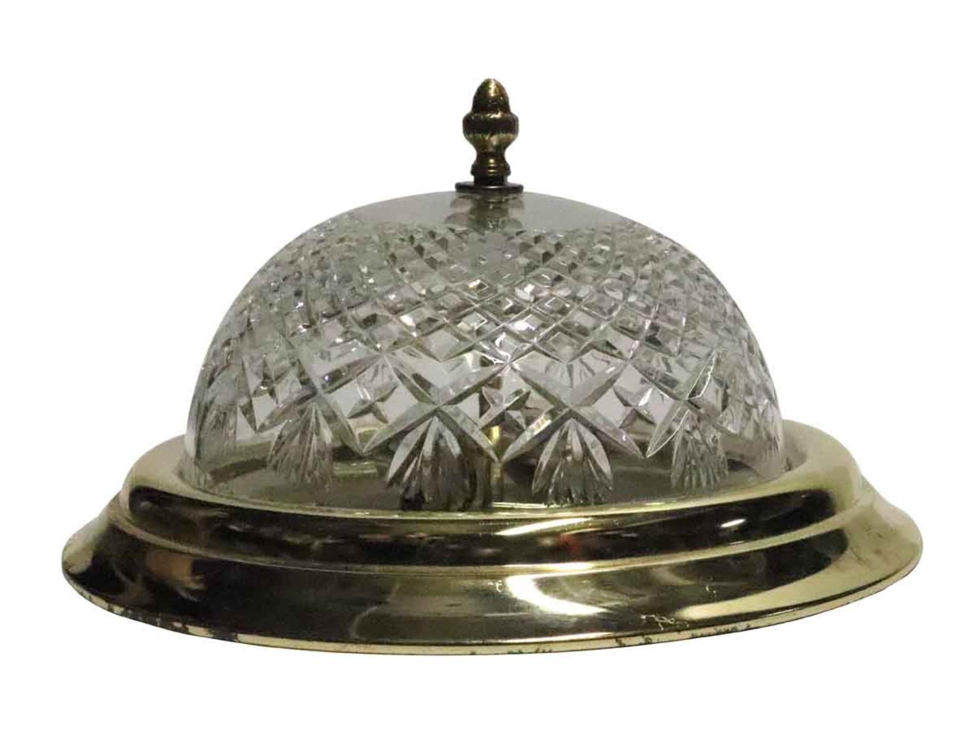 1990s Mid-Century Modern polished brass rim with a cut glass shade flush mount light fixture. This can be seen at our 400 Gilligan St location in Scranton, PA.