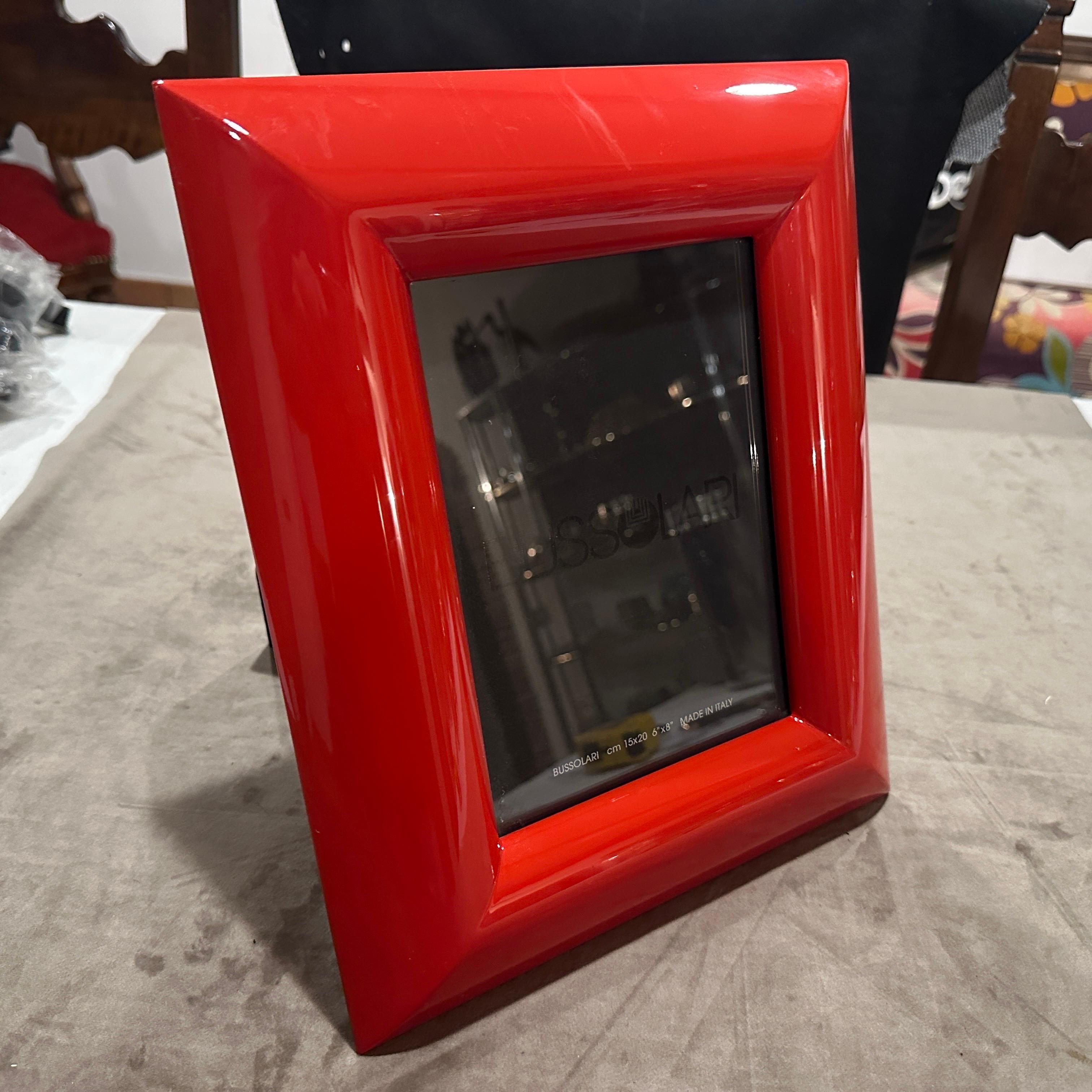 1990s Modern Red Lacquered Wood Italian Design Picture Frame by Bussolari.
Add a bold pop of color and sleek Italian design to your décor with this striking picture frame by Bussolari, crafted in Italy during the 1990s. Made from high-quality