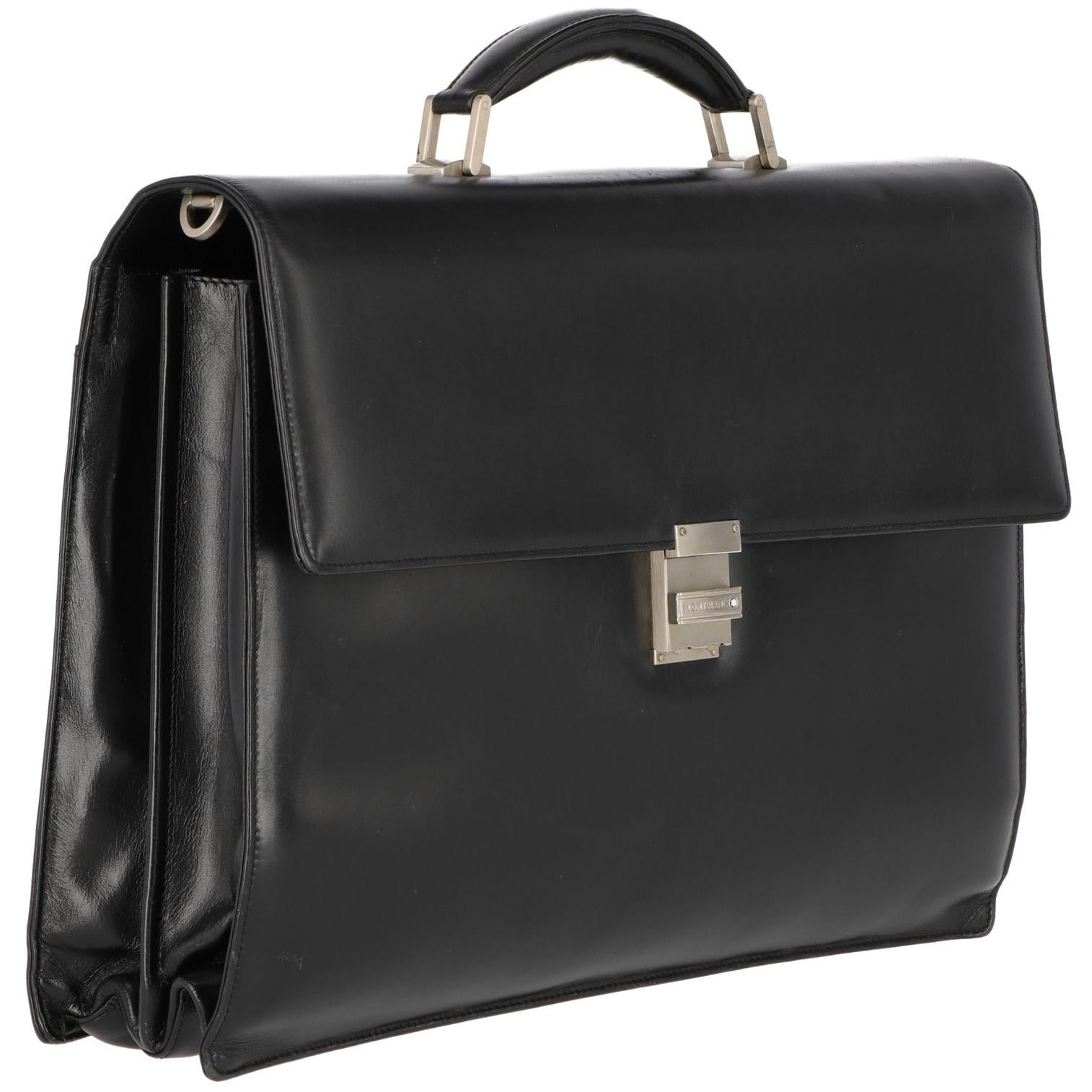 The elegant Montblanc briefcase is from the sophisticated Meisterstuck 1990s collection. In fullgrain calfskin leather, it features ousider and inner pockets and embellished by silver-ton metal details and buckles. Front closure  with combination
