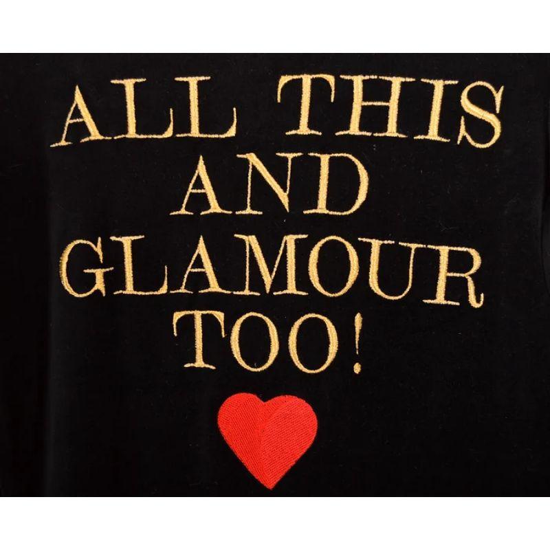 Kitsch Vintage 1990's Moschino black velvet 'ALL THIS AND GLAMOUR TOO' slogan embroidered velvet top with Gold and Red lettering detail under the infamous Franco Moschino 'Chic & Cheap' label.

Features:
Fitted shape
Long Sleeves
Rounded