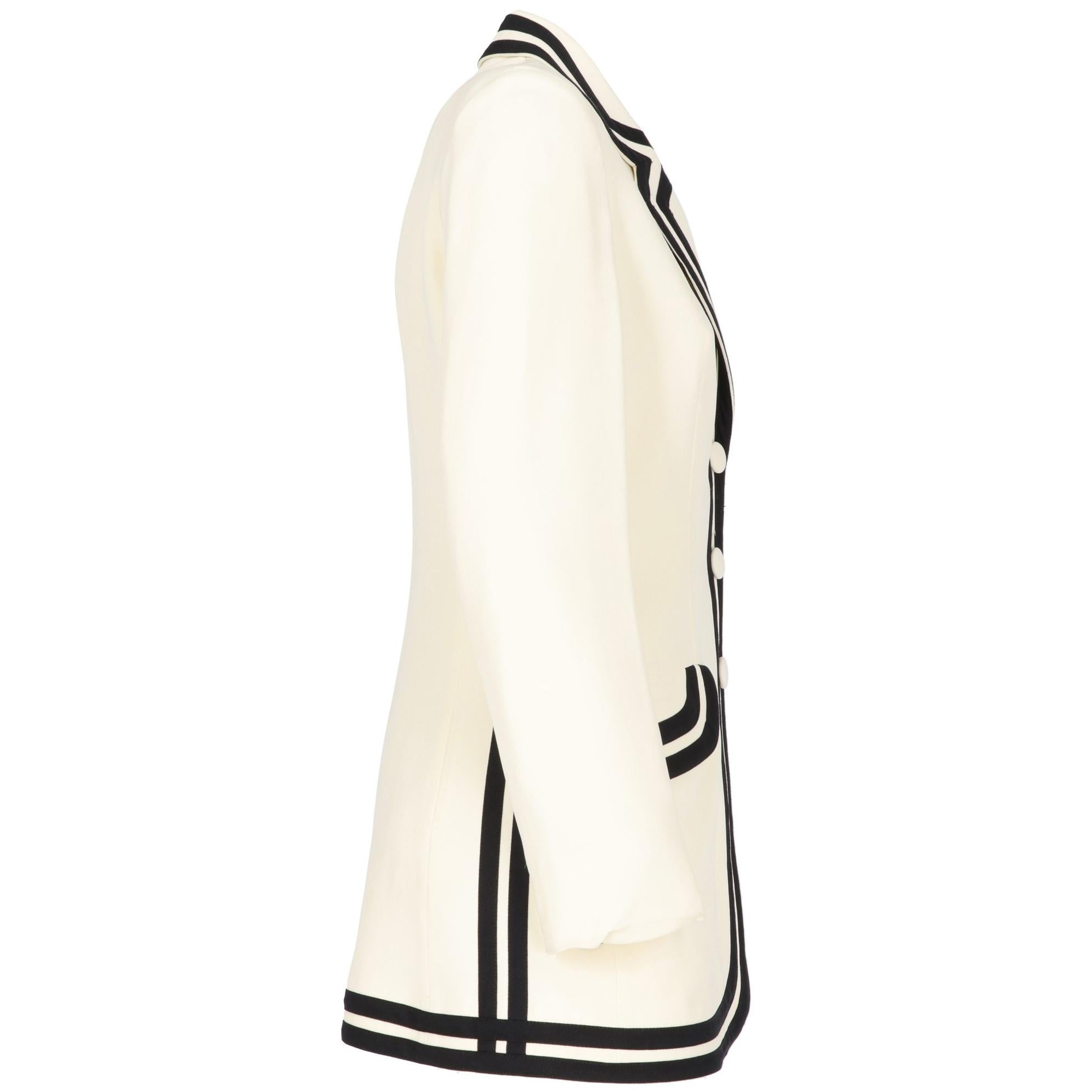 The elegant Cheap and Chic by Moschino ivory female blazer jackets features black decorative edges and inserts. With front buttoned fastening and a classic collar, the jackets features two front pockets with flaps and a soft lining. 
The jacket