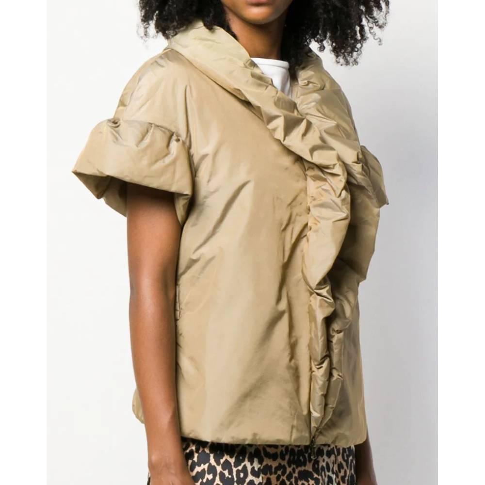 Moschino Cheap and Chic iridescent beige short sleeved padded jacket. Flared cut, with gathered shawl collar that goes on along the front zip fastening. 

Item's lining and upper slider have been repaired, as shown in the pictures. Item shows a