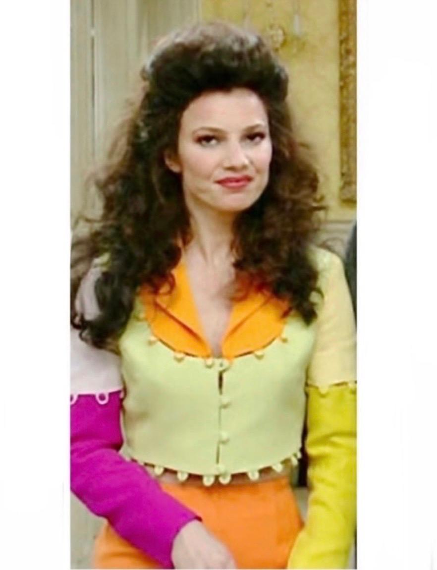 Unique 1990's Moschino Cheap and Chic vintage puzzle jacket featuring a color-block design in vibrant shades of yellow, orange, green and pink. 
As seen on Fran Dresher in the sitcom 
