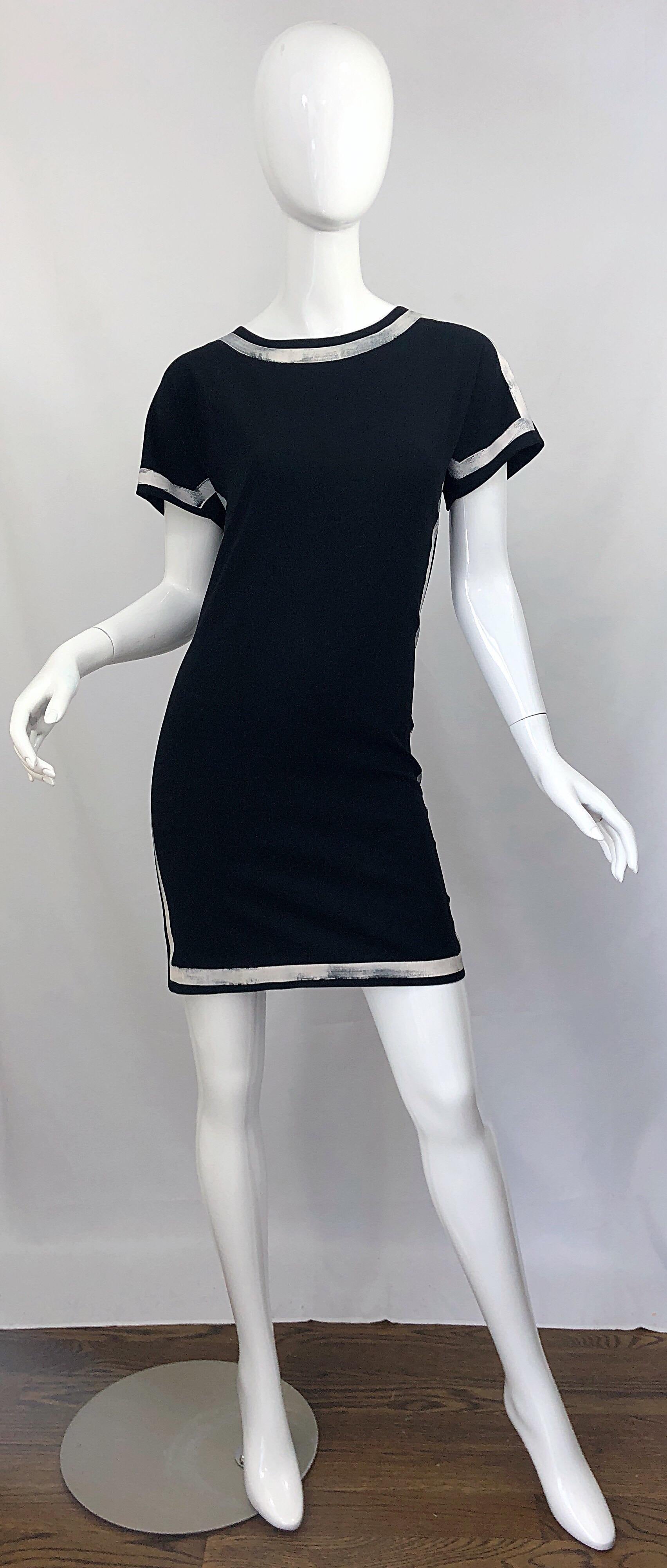 Amazing vintage early 2000s MOSCHINO CHEAP & CHIC black and white hand painted short sleeve y2k dress! Features flattering white handpainted white stripes around the neck and sleeves, and down the front and back sides. Hidden zipper up the side with