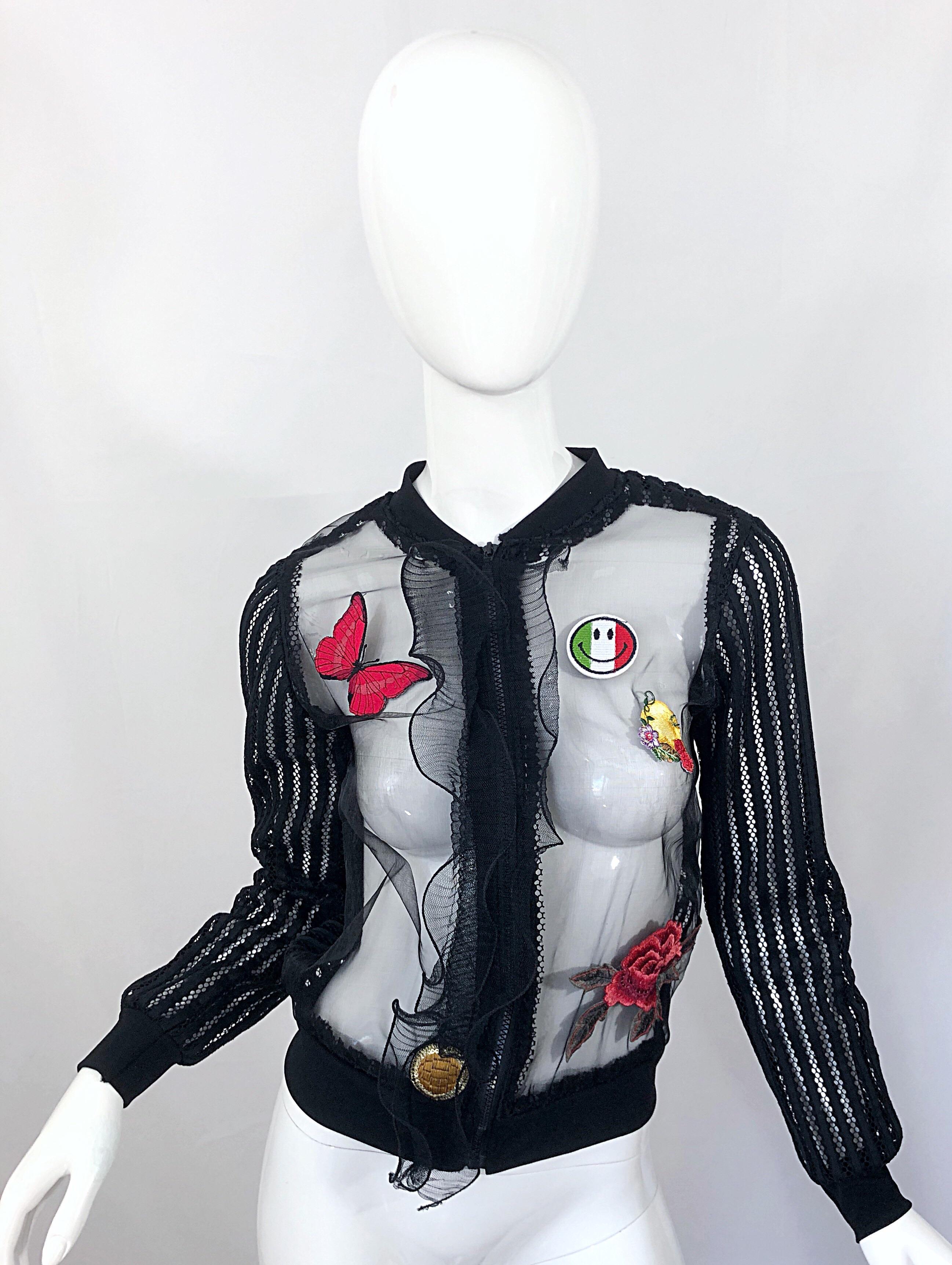 Fantastic vintage 90s MOSCHINO CHEAP & CHIC sheer fishnet zip up jacket / top! Features patchworks thorughout. Avant Garde wired ruffle out the front center. Elastic waistband and sleeve cuffs. The perfect layering piece! In great condition. Made in