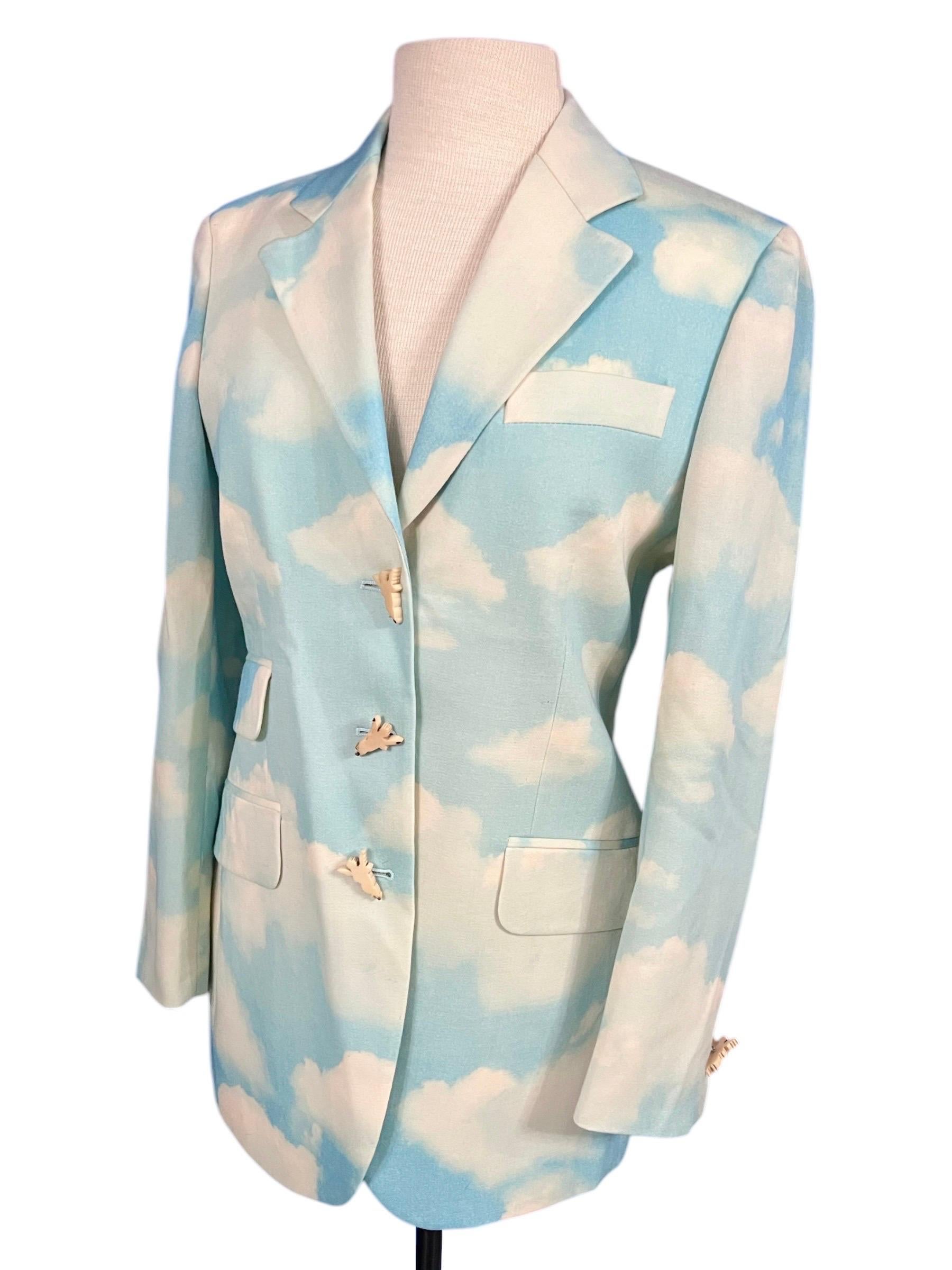 1990's Moschino Cheap & Chic vintage cloud sky printed blazer.
Wooden angel cherub buttons.
Made in Italy.
100% wool.

Size: US size 6

Condition: In excellent condition throughout

Measurements:
Bust- 36”
Waist- 32”
Length-29”