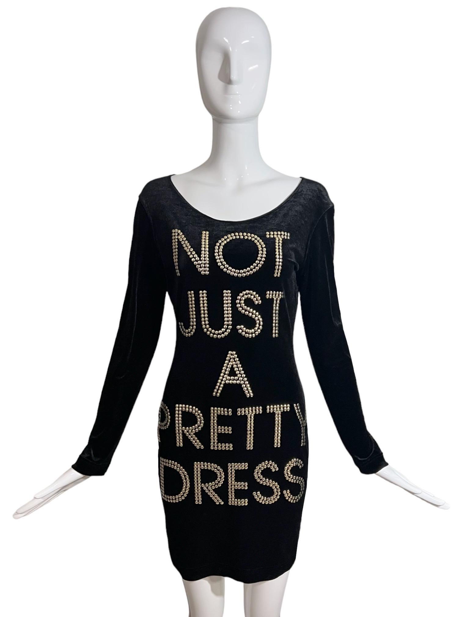 Moschino Cheap and Chic 1990's black velvet form fitting dress with a whimsical quote studded on the front stating 