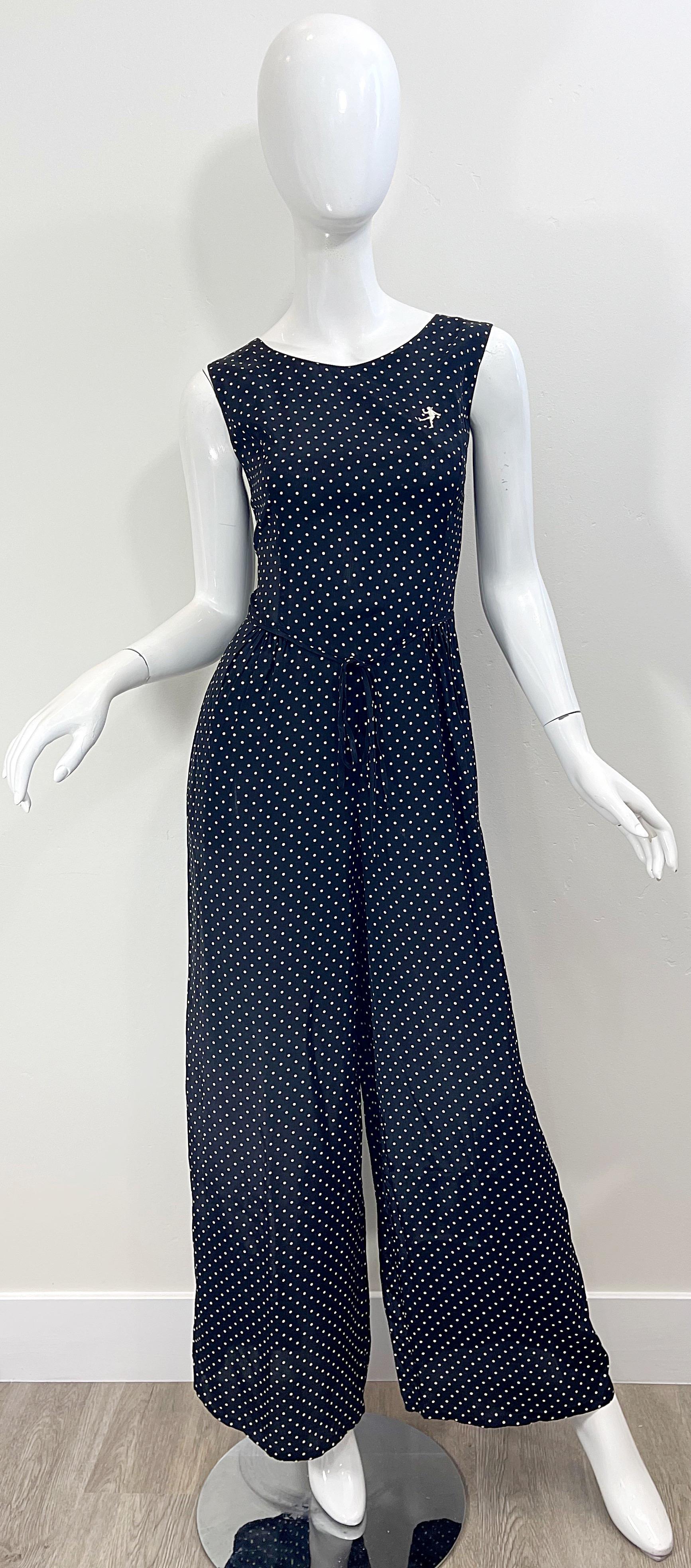 Awesome vintage 90s MOSCHINO Cheap & Chic black and white polka dot novelty print Popeye Olive Oyl one piece jumpsuit ! Features a super soft rayon. Tailored bodice with full legs. Pockets at each side of the hips. Drawstring at center waist. Hidden