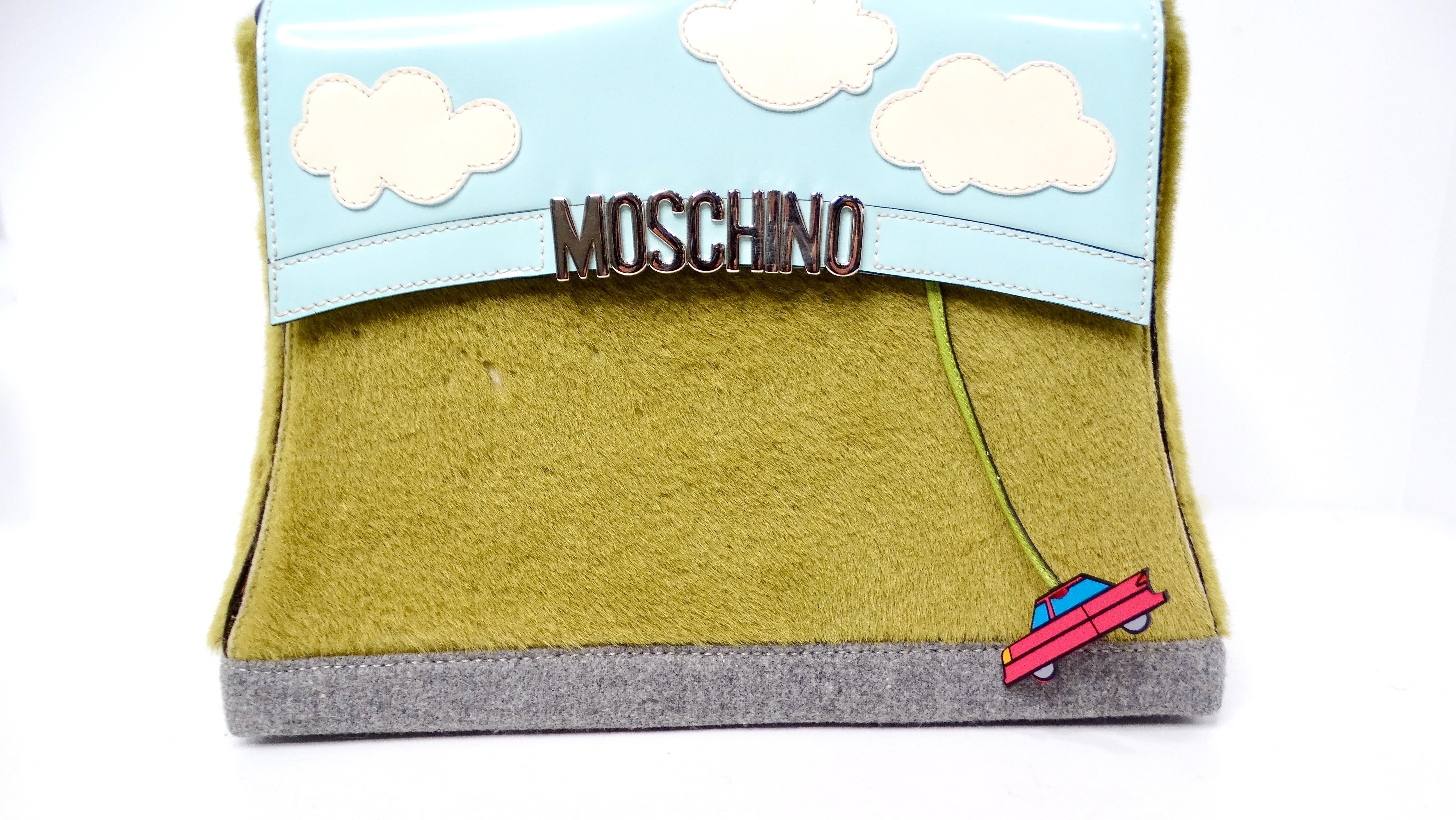 The 1990s Moschino Clouds Grass Car Novelty Structured Shoulder Bag is a statement piece that seamlessly merges whimsy and luxury. Crafted from vibrant green pony hair, the bag's grass accents provide a playful texture that sets it apart. The