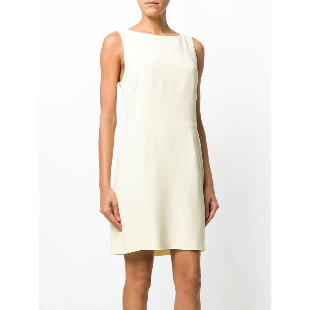 Moschino cream color mixed acetate short dress. Round neckline, sleeveless. Side zip closure, three decorative back bows and uncovered back.

Years: 90s

Made in Italy

Size: 46 IT 


Flat measurements:

Lenght: 89 cm
Bust: 45 cm 
Waist: 39 cm