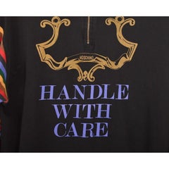 1990's Moschino 'Handle with Care' Quarter Zip Colourful sleeved Sweater