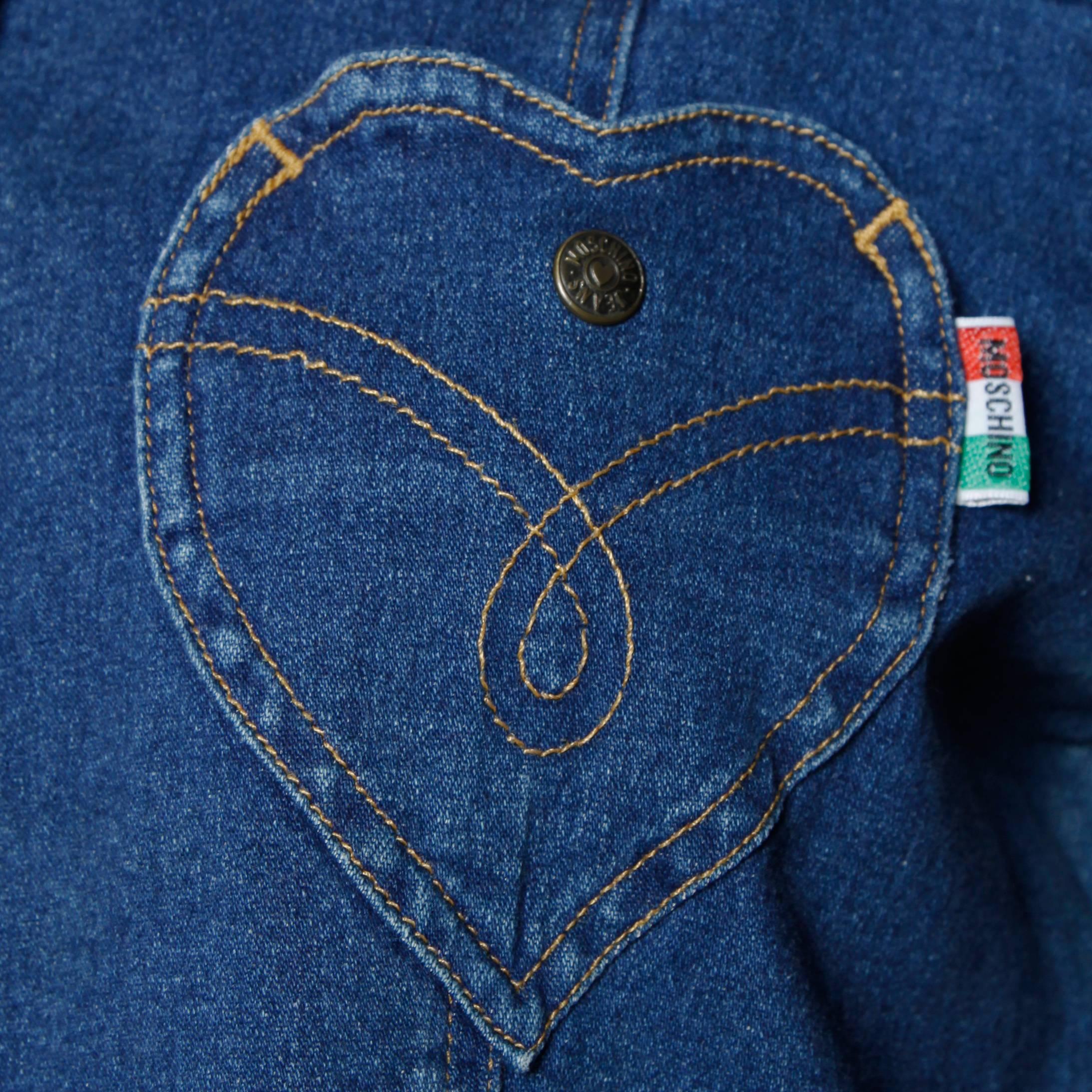Vintage denim shirt or jacket with a heart pocket and snap up front by Moschino Jeans. Unlined
with front pockets and front snap closure. Fabric: 98% Cotton/ 2% Elastic. The marked size is  I 44/ US 10/ F 40/ GB 14/ D 40 and the top fits like a