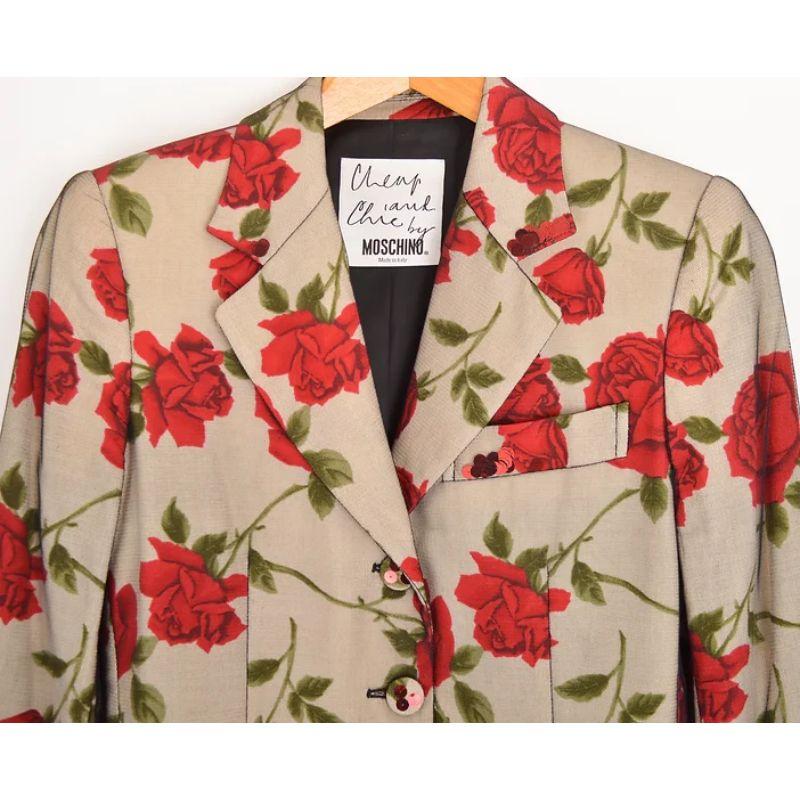 Early 1990's Vintage 'Cheap & Chic' label, Moschino 'Rose' patterned button down Blazer, with shimmery sequins encased between a White floral material with a black mesh over-layer. 

MADE IN ITALY !

Features:
Central line buttons
Exterior