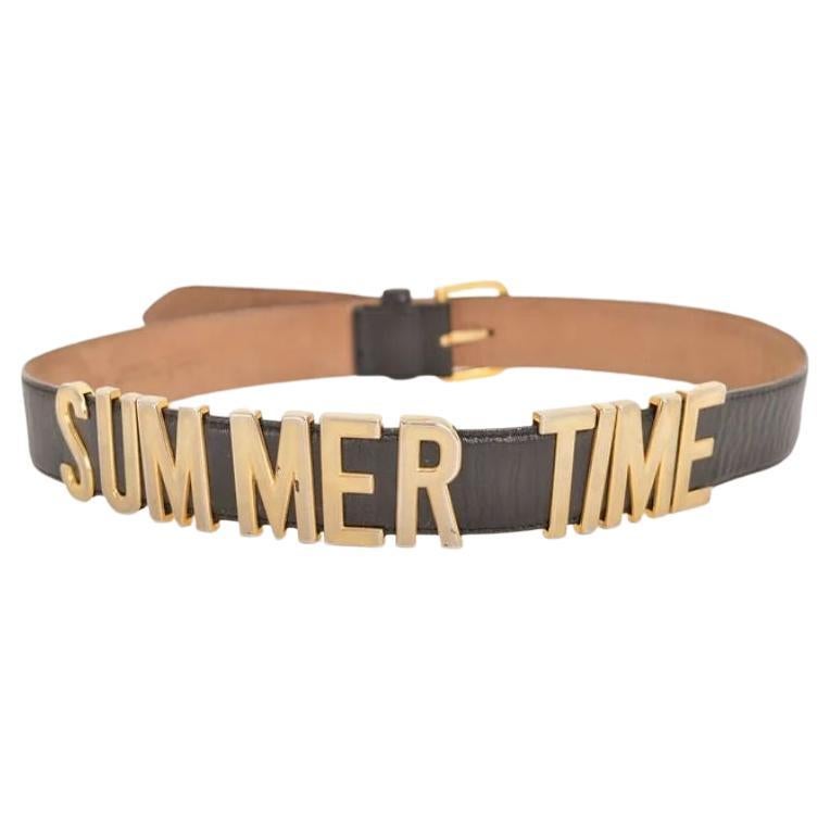 1990's Moschino Vintage 'Summer Time' Gold Letter Black Leather Waist Belt en vente
