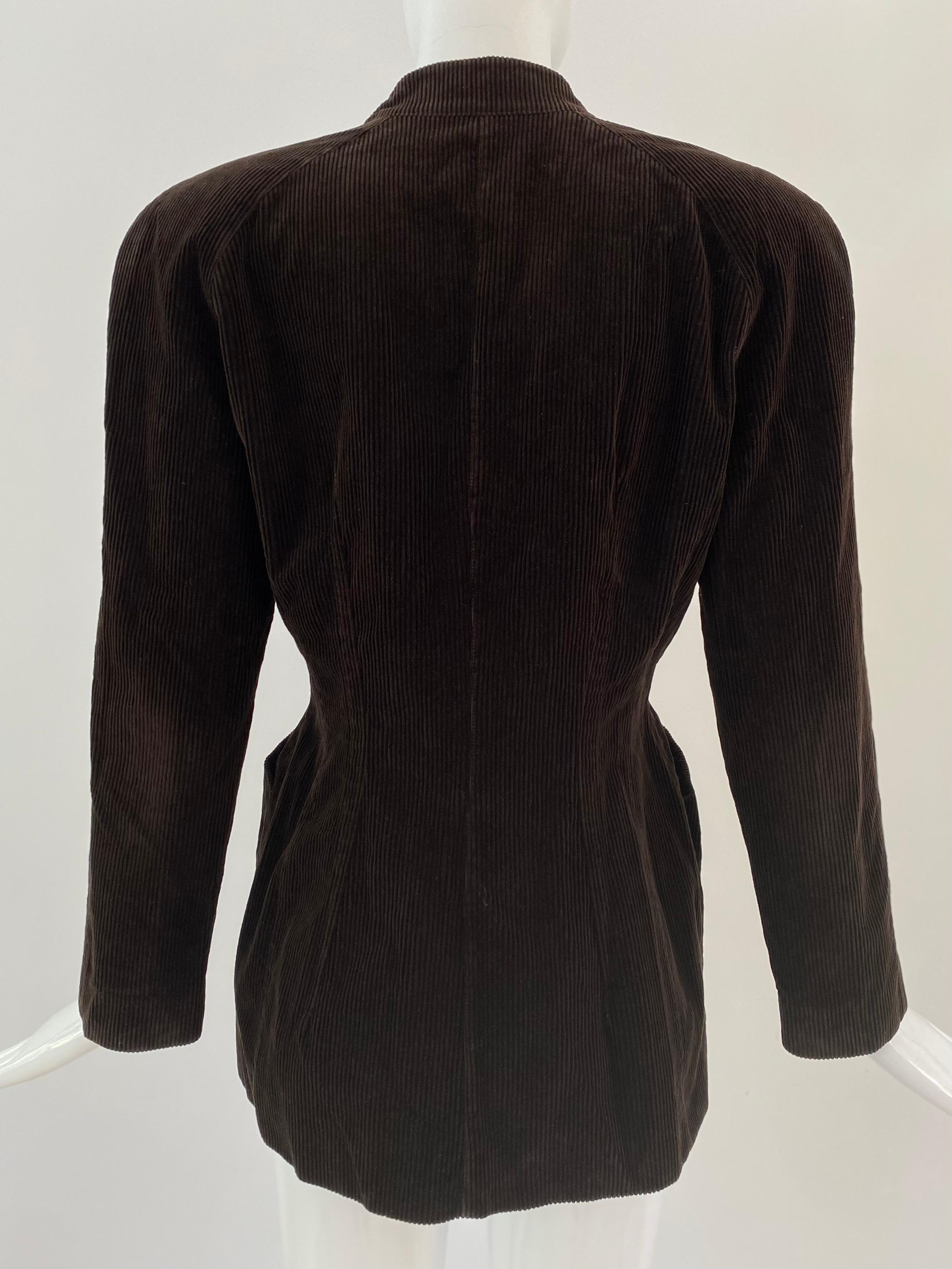 Introducing a timeless fashion piece from the 1990s, the Thierry Mugler jacket in an hourglass shape. Crafted from a luxurious deep brown corduroy fabric, this jacket can be used as for daytime casual while also exuding a distinct sense of