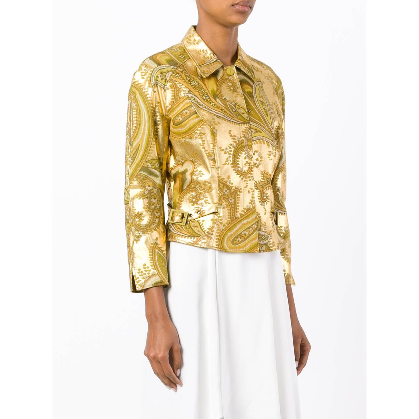 Mugler golden acrylic crop jacket with geometric print. Classic collar and front closure with snap buttons. Long sleeves and straps with buckle on the hips.

Years: 90s

Made in Hungary

Size: 40 IT

Flat measurements

Height: 53 cm
Bust: 43