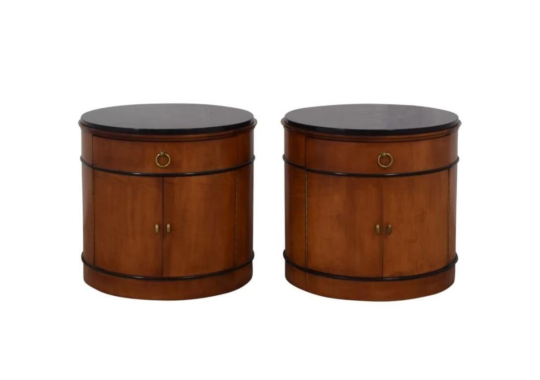 Add a touch of elegance to your living space with this remarkable set of National Mt. Airy Biedermeier Style drum form nightstands/bedside tables that could also serve as dry bar cabinets, side tables, or lamp tables. Heirloom-quality furniture that