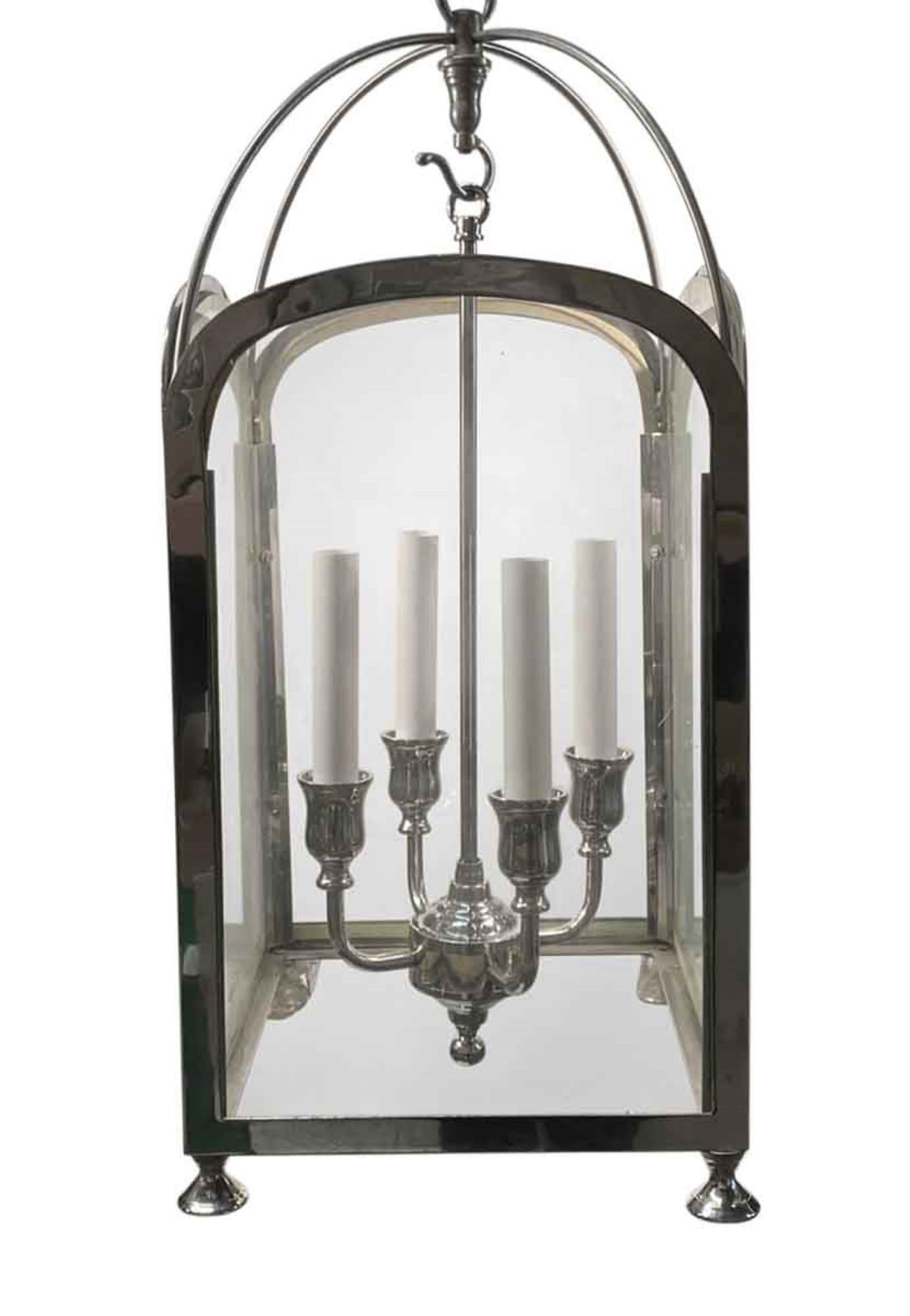 1990s four light nickel finish brass foyer or entryway lantern with simple lines done in a Mid-Century Modern style. Price includes restoration. Please specify the overall drop that is needed upon purchasing. Small quantity available at time of