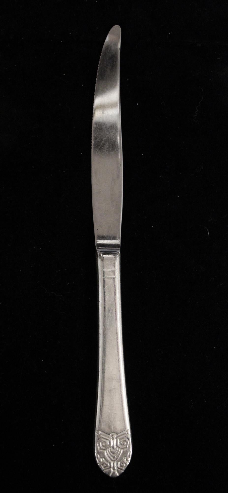 1990s silver plated steel eight piece steak knife set. From the Waldorf Astoria in New York City. Some are stamped 